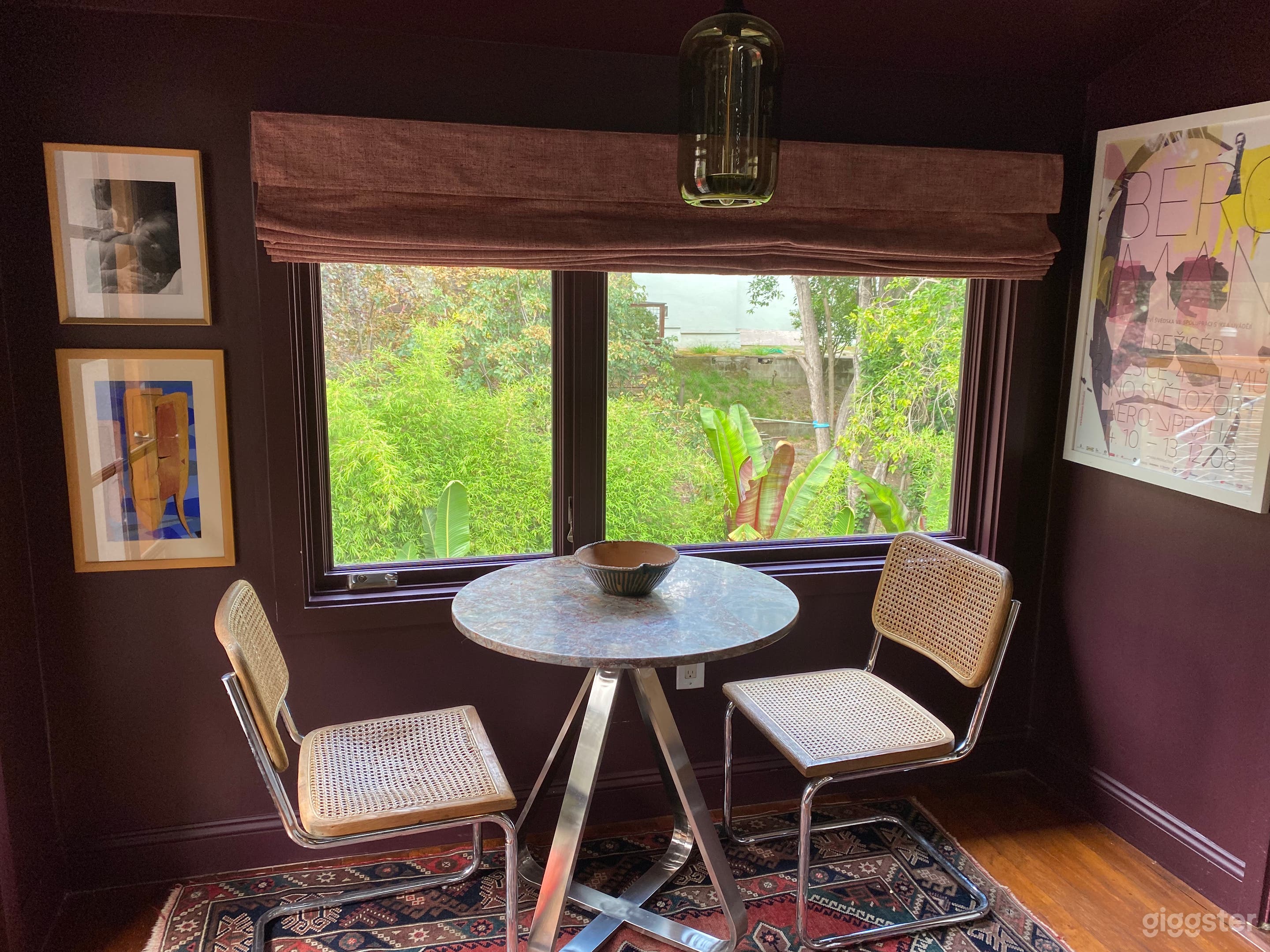 Breakfast nook overlooking lush yard. 