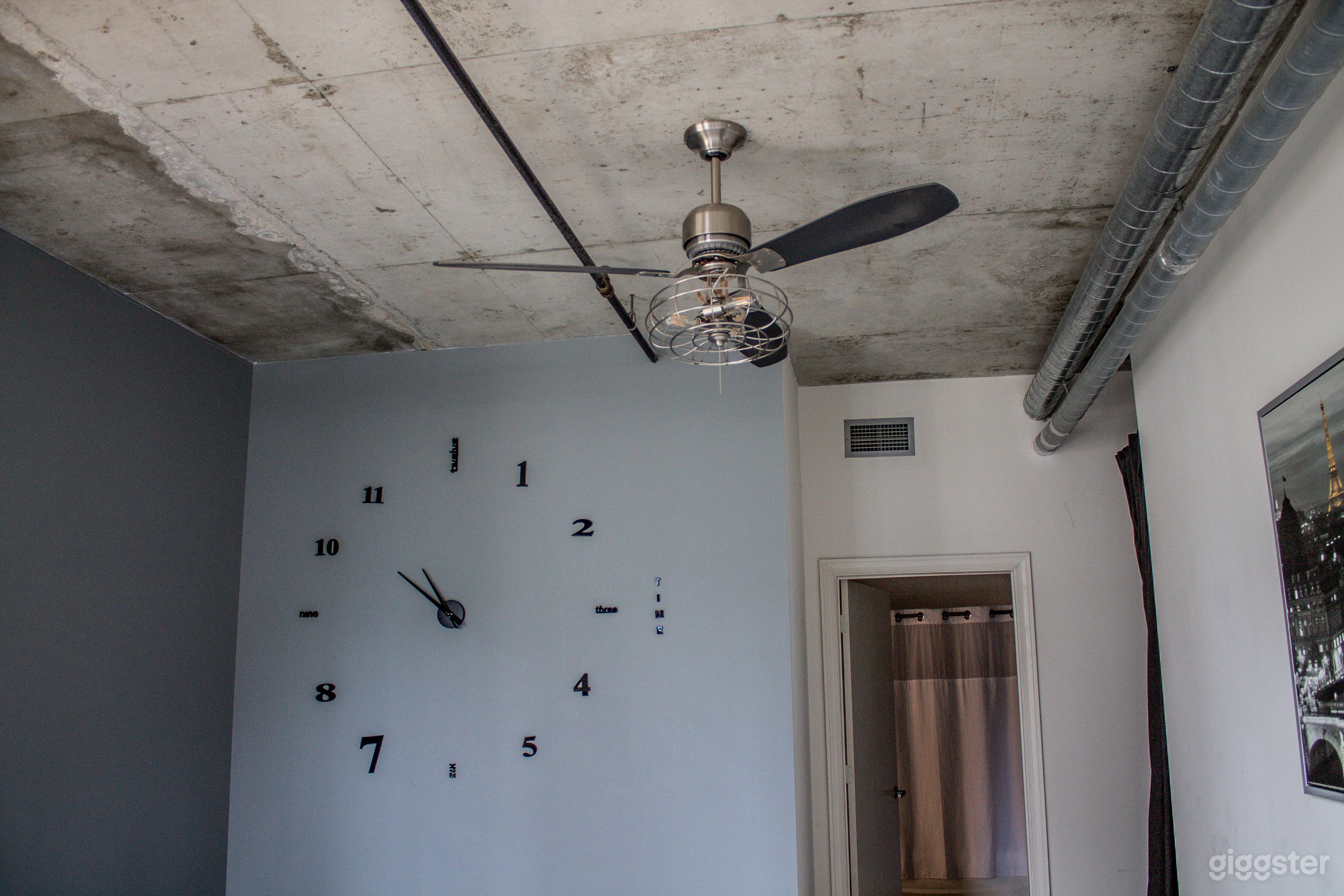 Bedroom with large wall clock