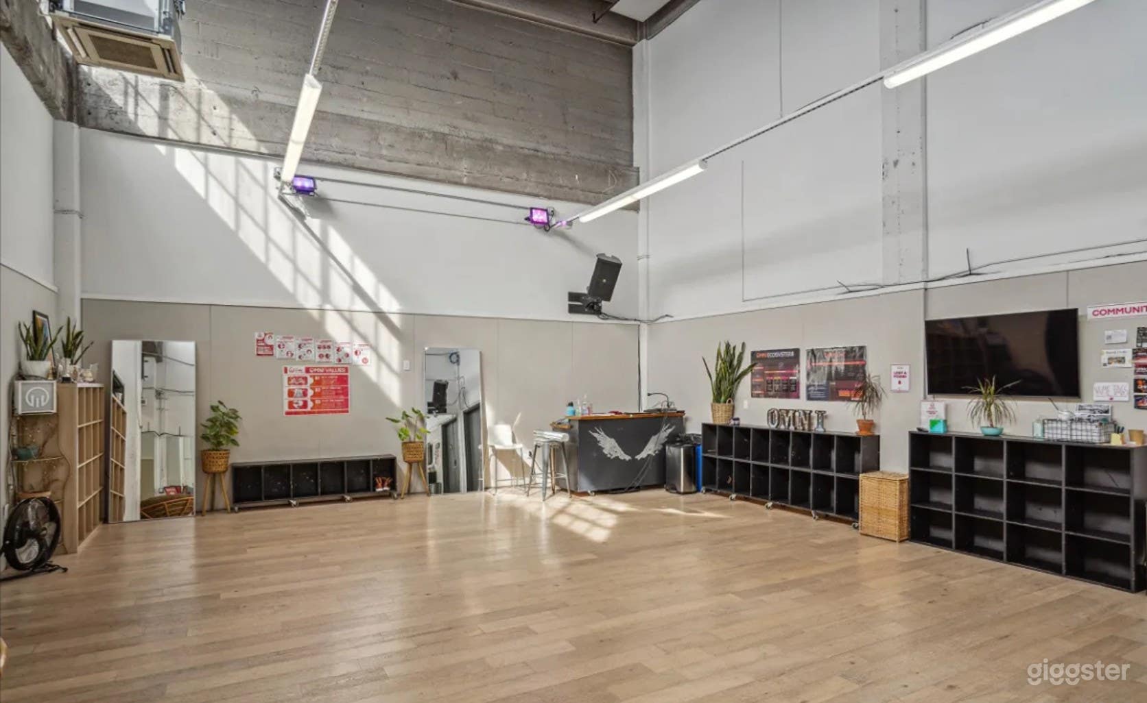 Dynamic dance studio with wall mirrors and sound system Photo 1