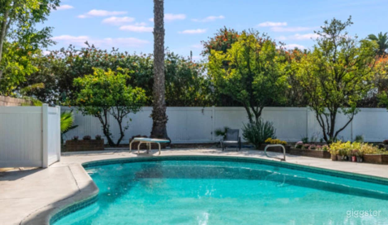 Classic Backyard Pool with Diving Board  Photo 4