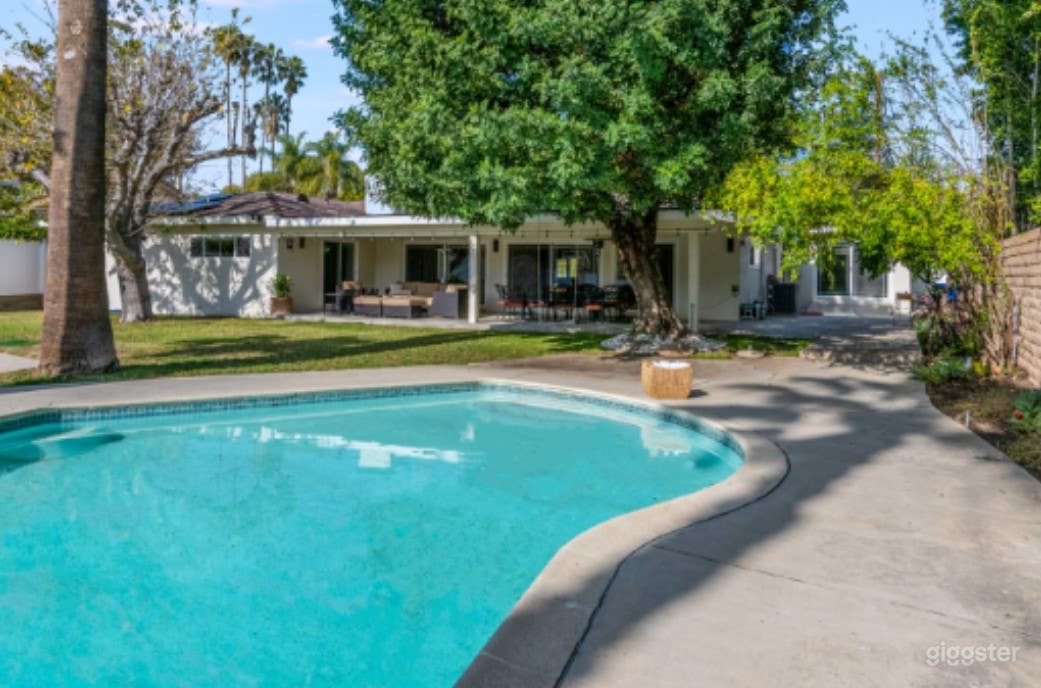 Classic Backyard Pool with Diving Board  Photo 2