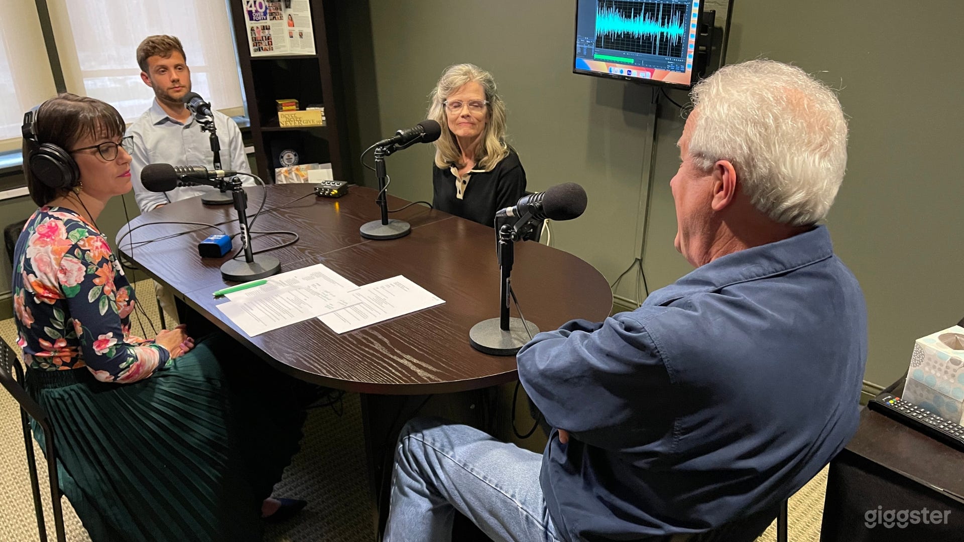 Podcast studio equipped with 4 mics, cameras, remote guest capabilities and professional production staff.