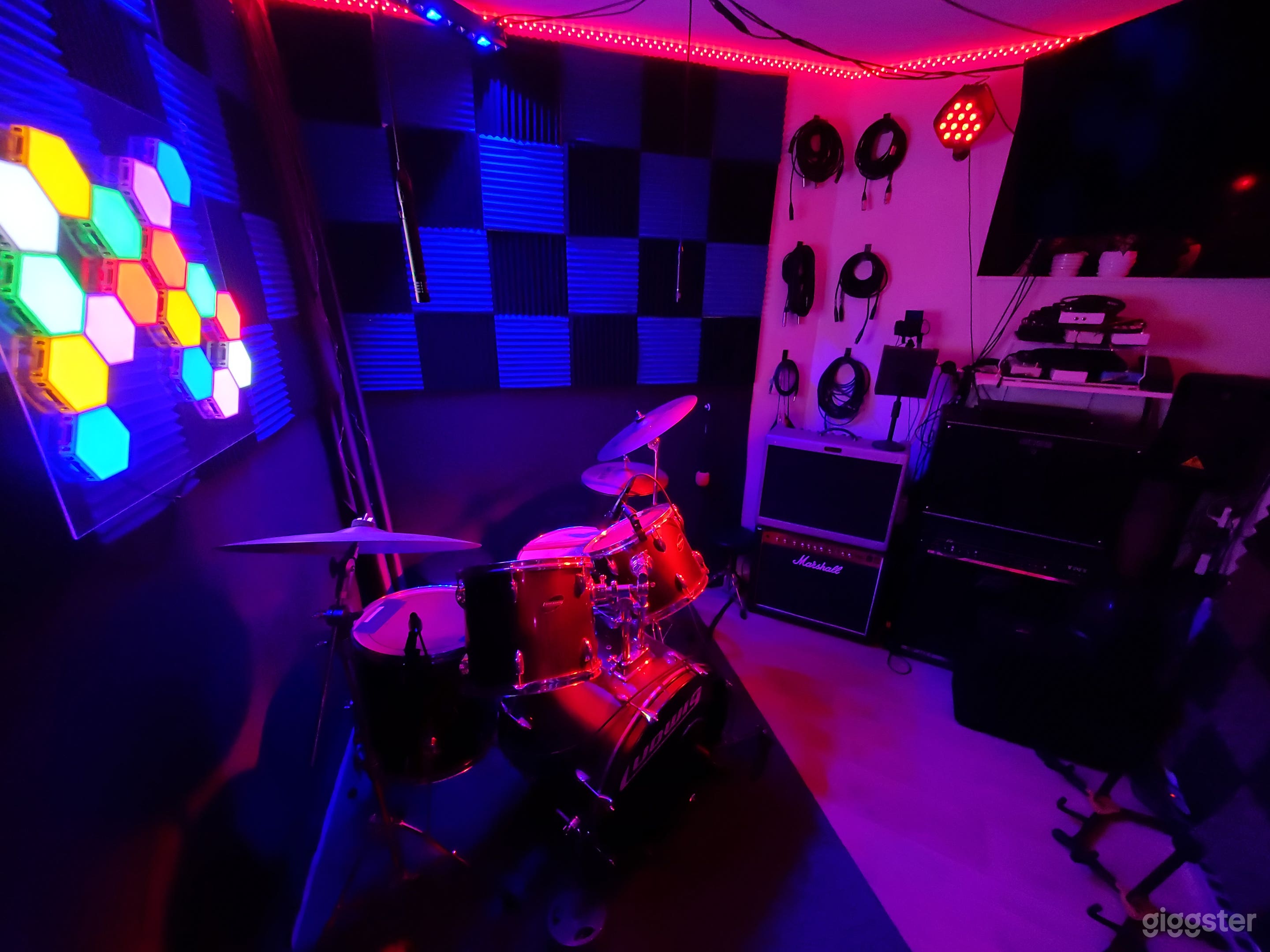 Fully mic'd iso booth with drums, tube amps and fully customizable lighting. 