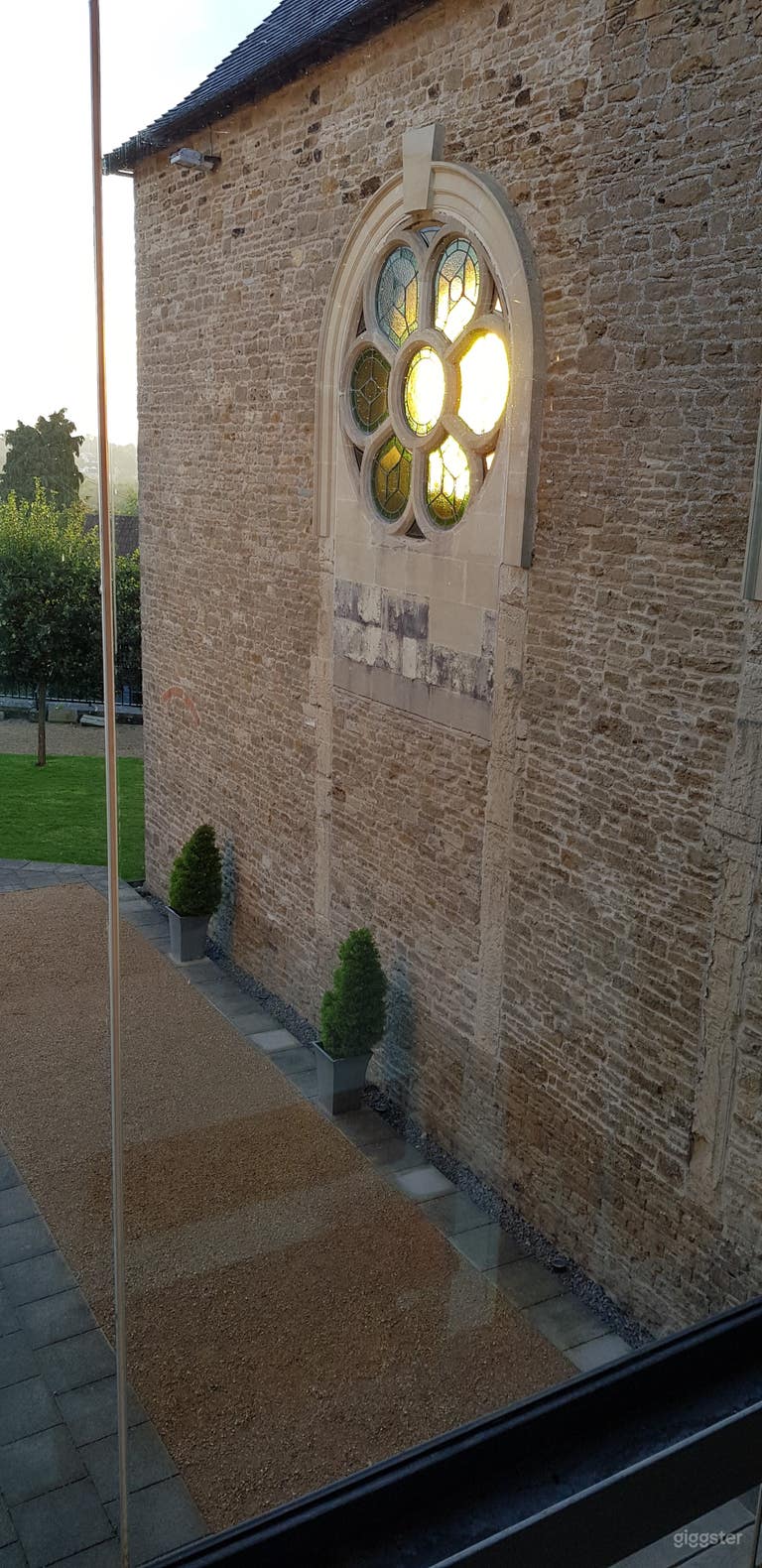  rear of rose windows from inside glass extension. 