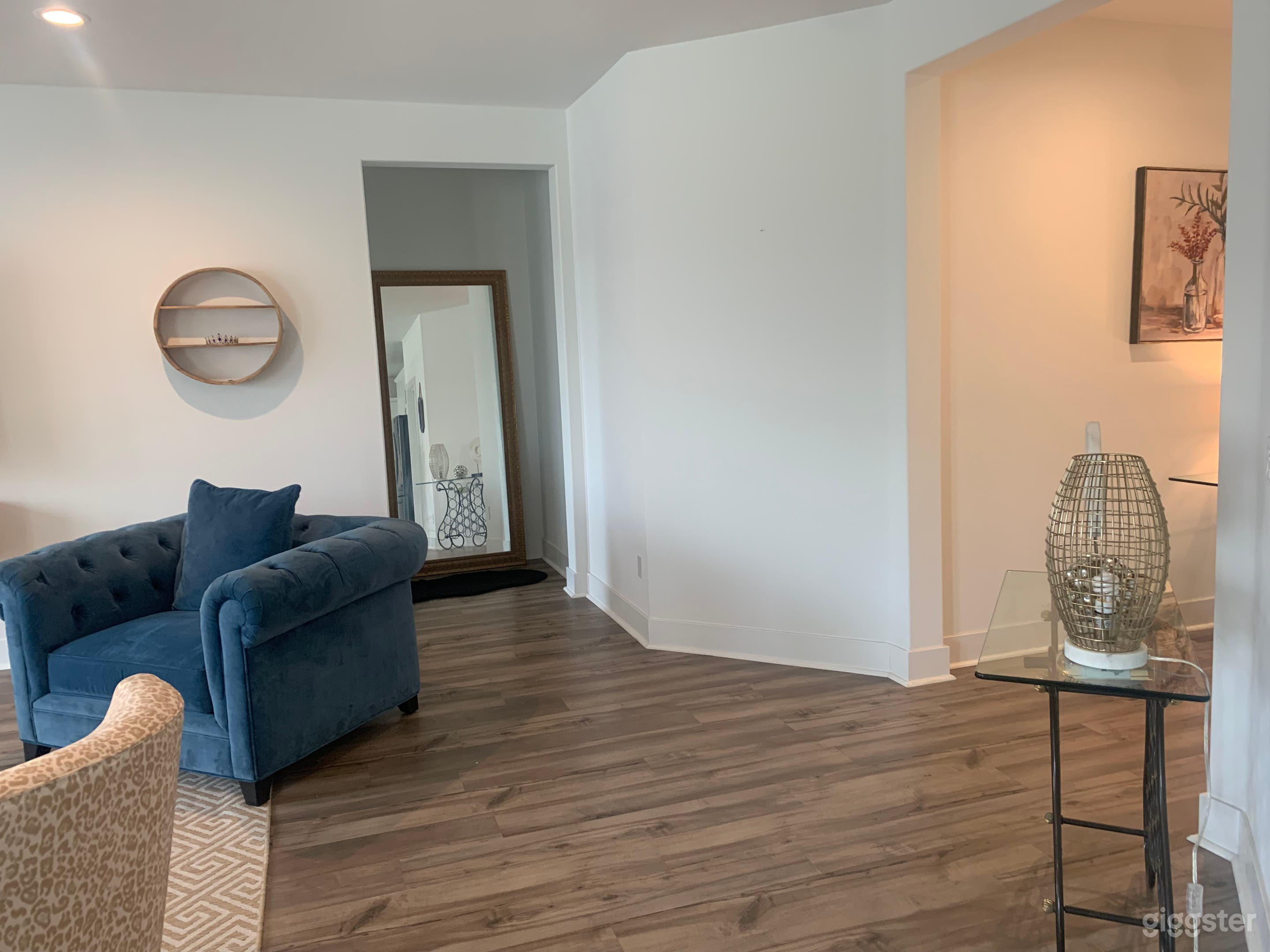 Living area with entrance area leading to master bedroom 