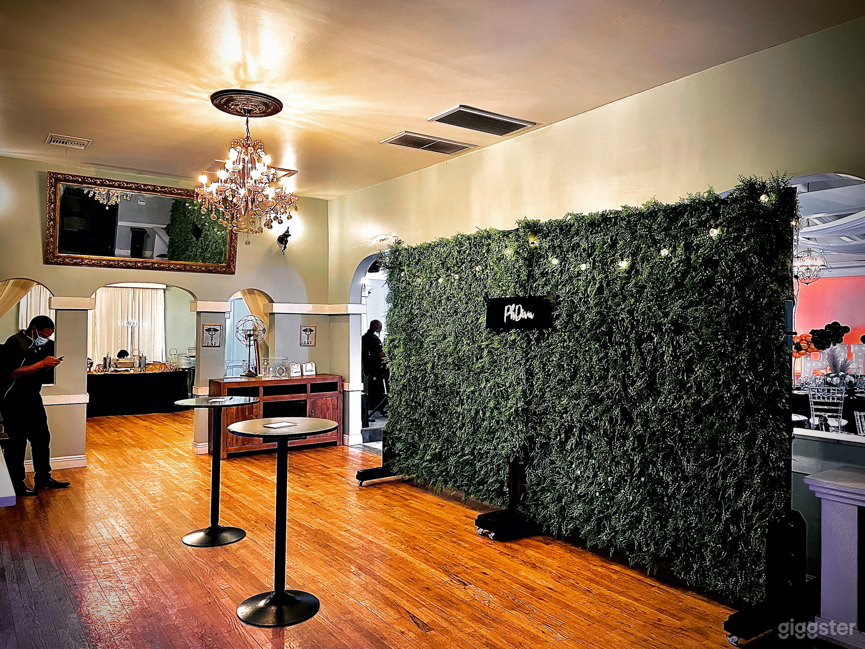 Lounge entrance with the original wooden floors, and large mirrors throughout 