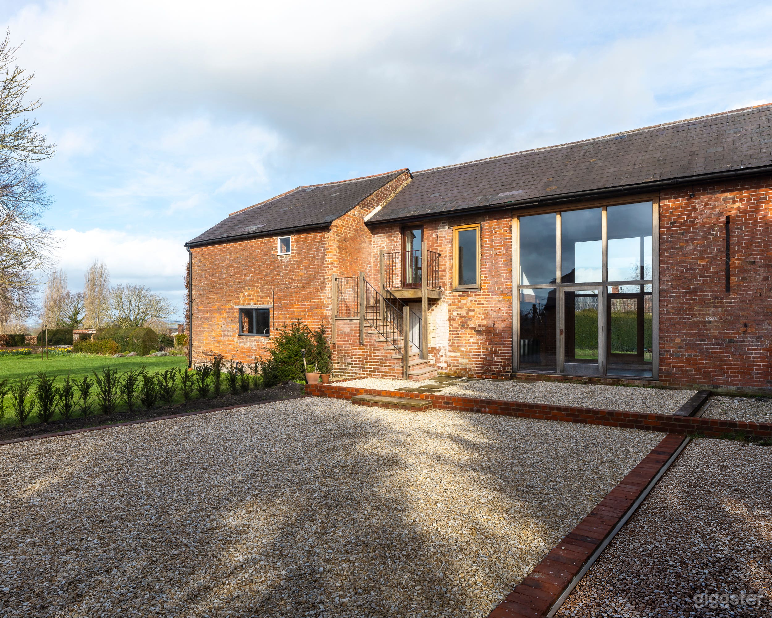 Contemporary barn conversion with floor-to-ceiling windows Photo 1