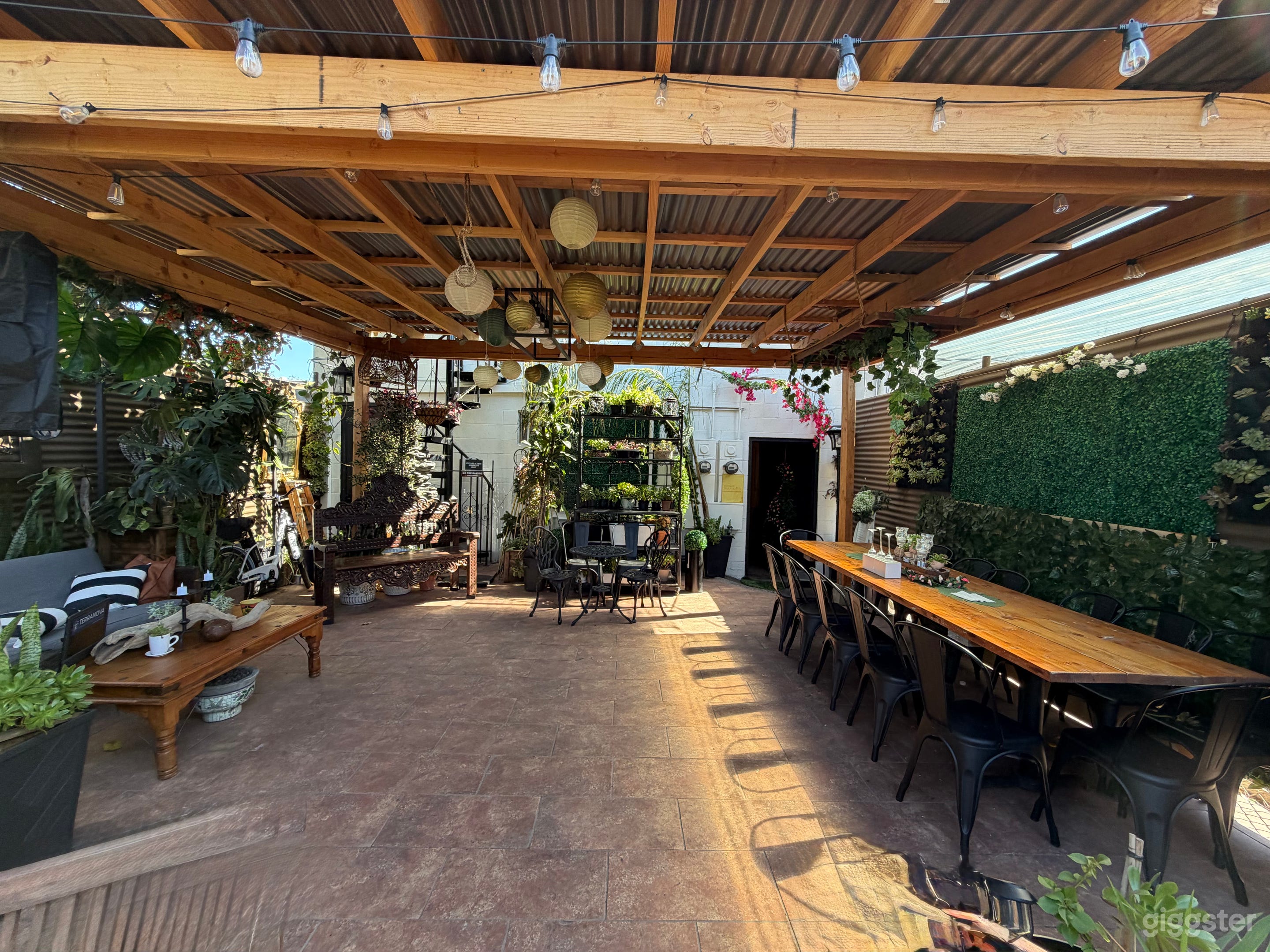 Patio under pergola. View from the back.