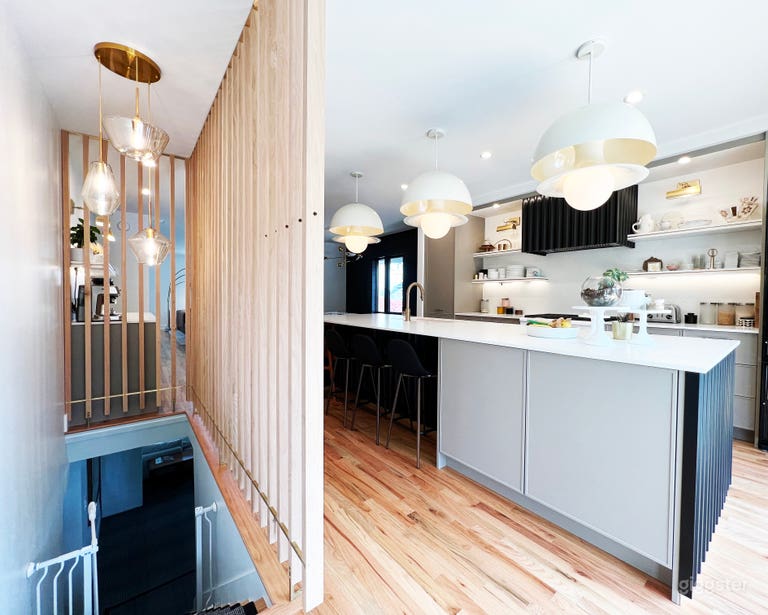  Open spaces leading from one room to the next. Bar seating at the island for three.  