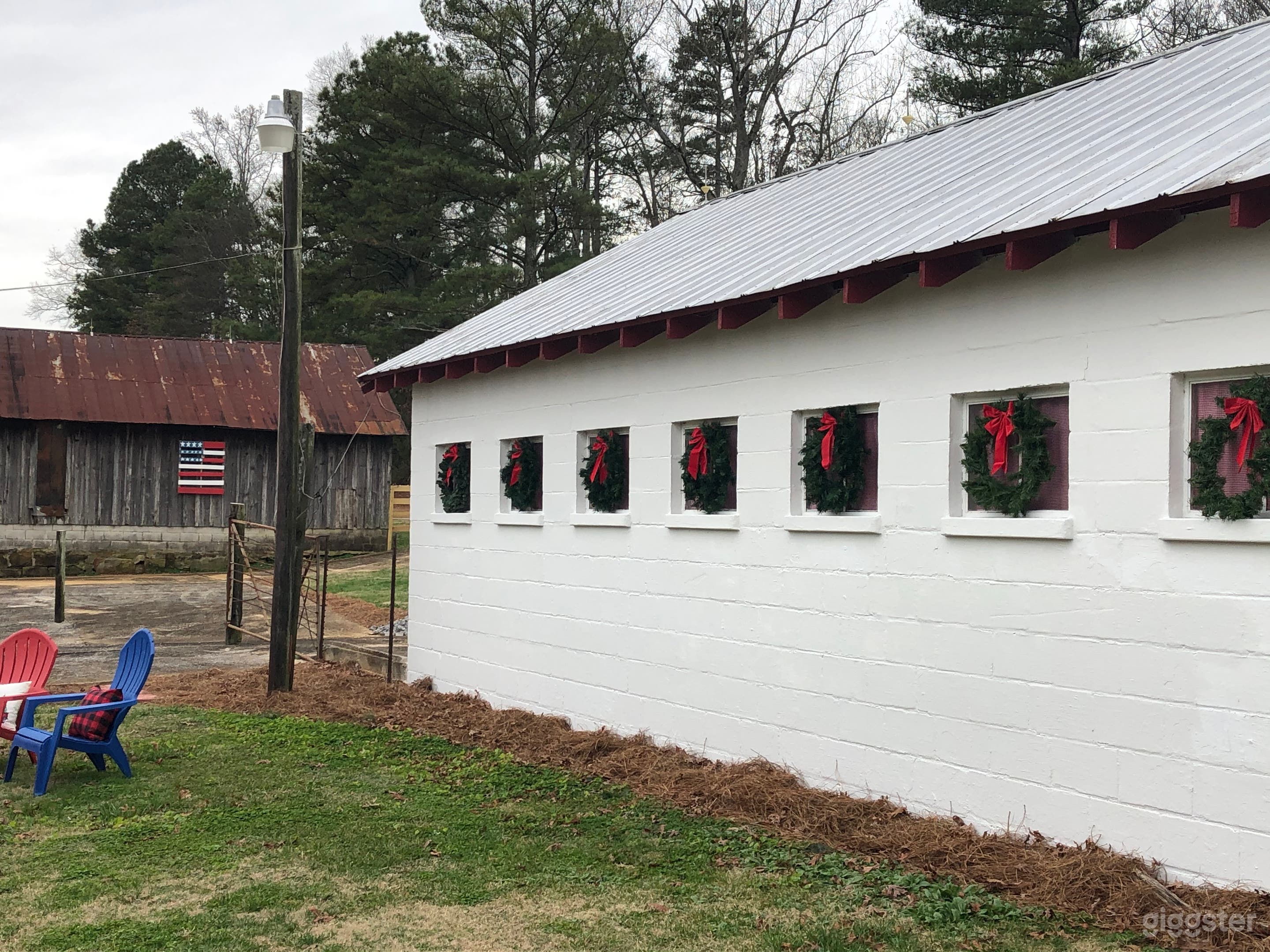 Side view of the original dairy barn at Christmas.  