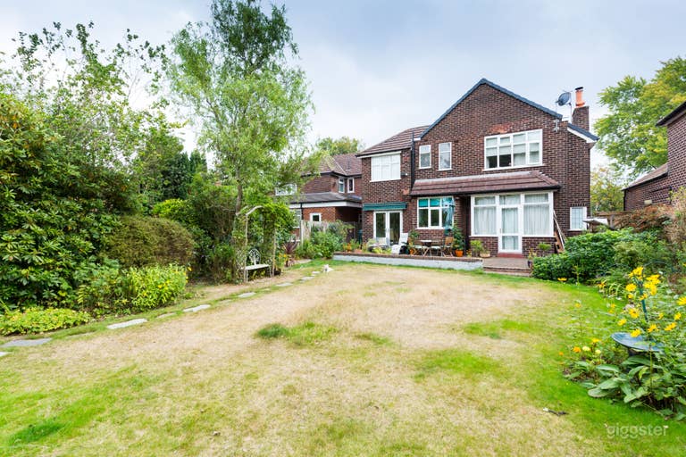  Back view of house (the grass is usually green but we have had a drought recently) 