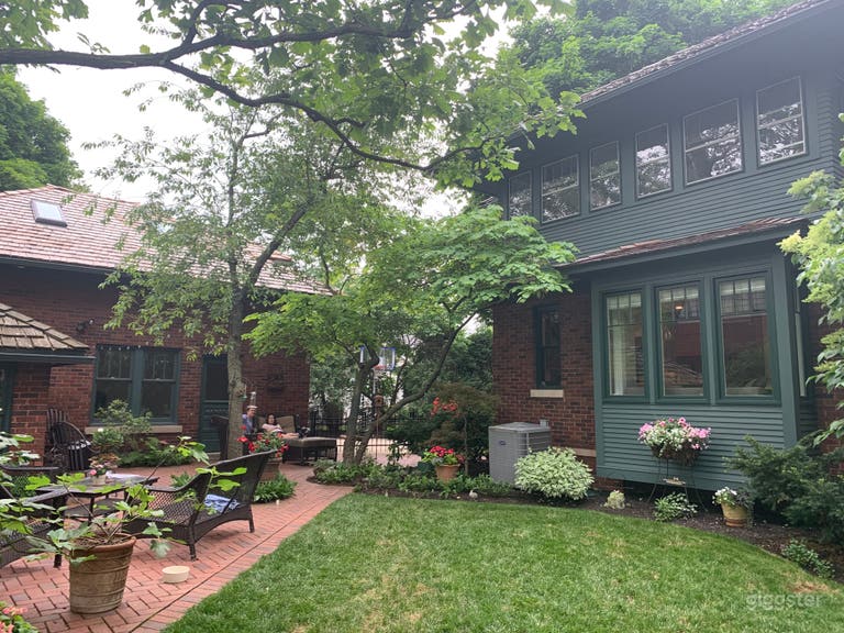  Back yard, showing main house on right, detached garage, upper left, and roofline of mini (brick) playhouse on far left. 
