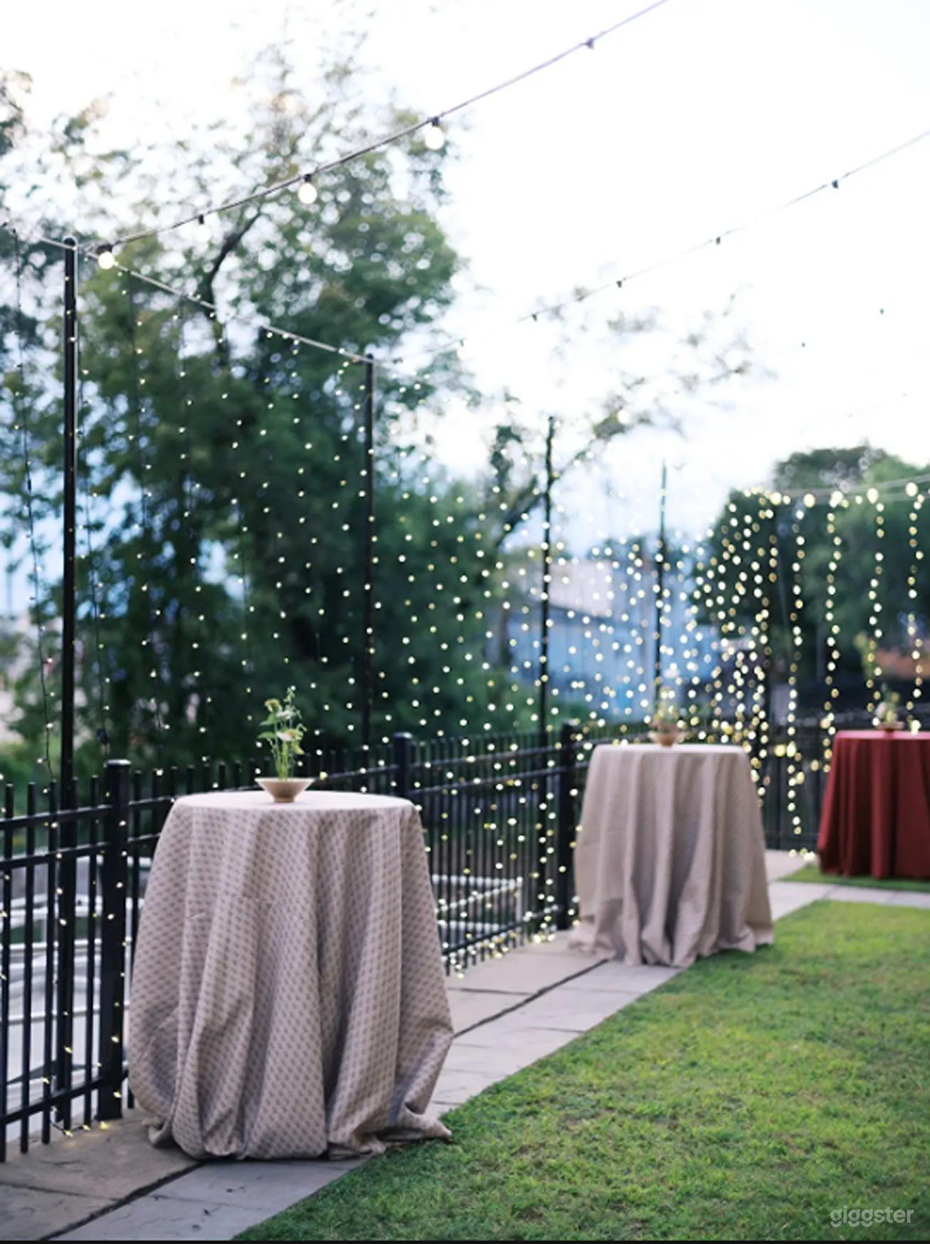 Urban Upper Courtyard with Bistro Lights & Red Brick Charm Photo 4