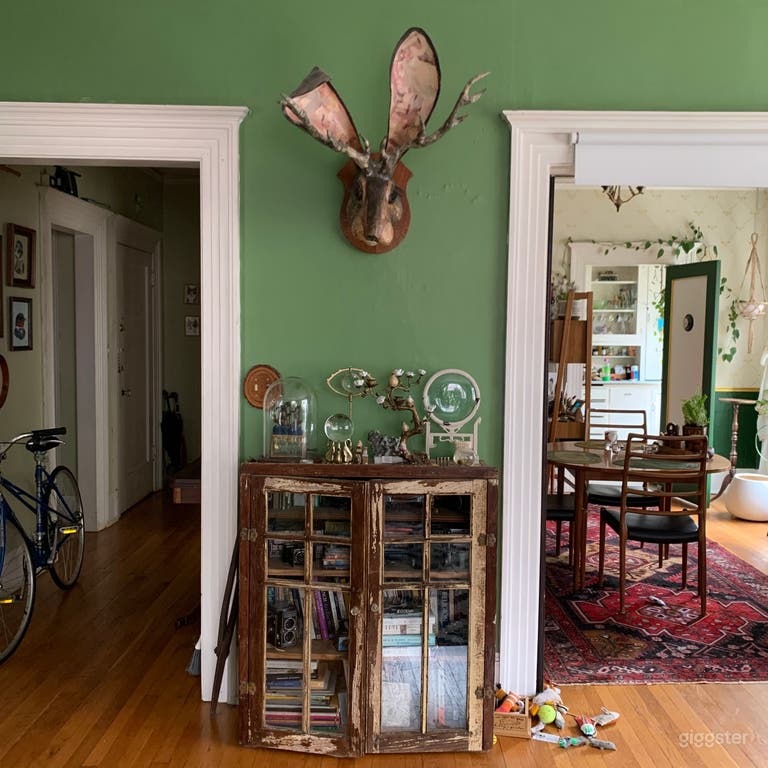  The living room has a hallway to the left and opens to the dining room on the right with pocket doors.  