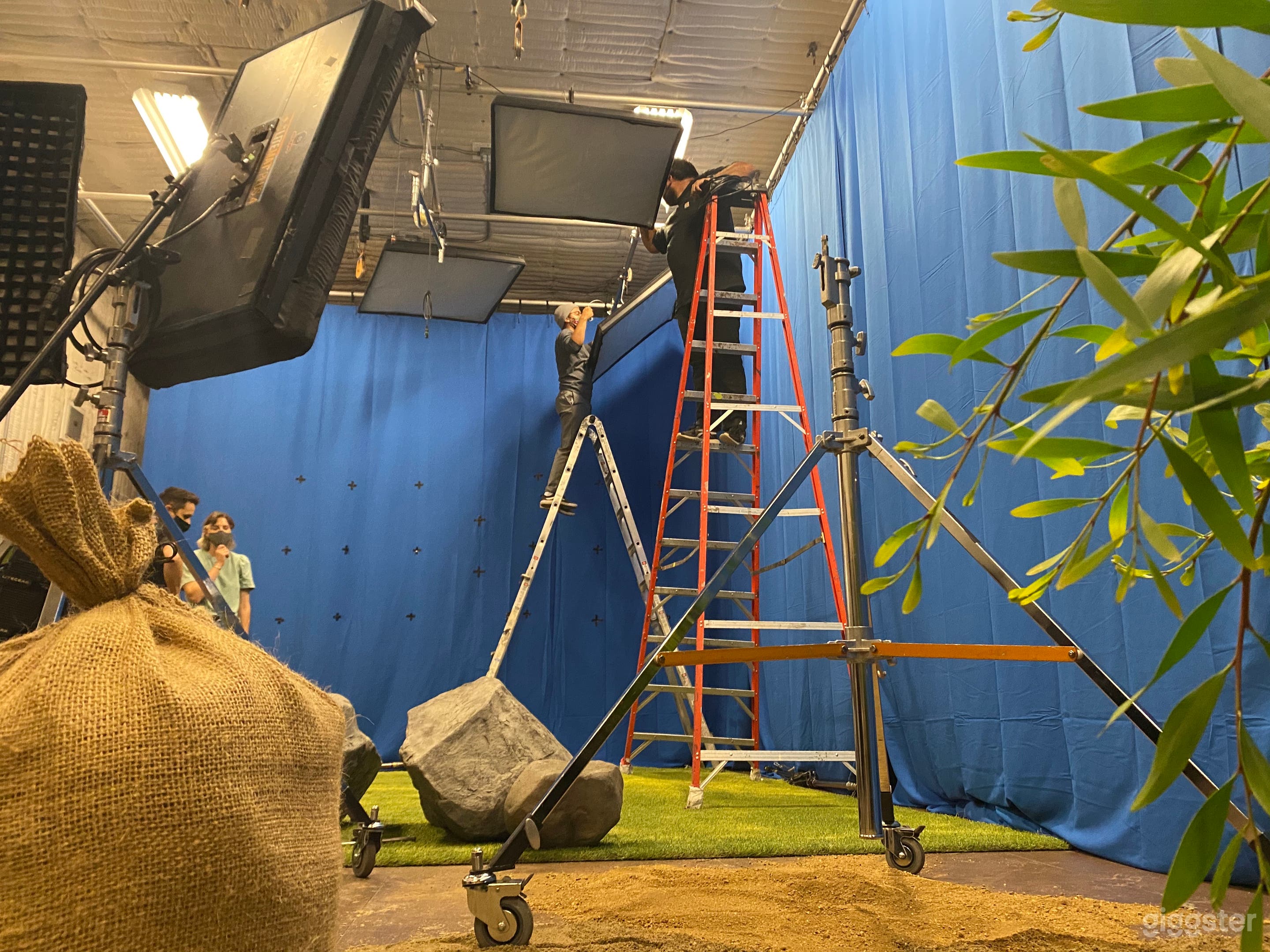 Large soundstage with stunt pulleys, green and blue screens, wall-to-wall track system