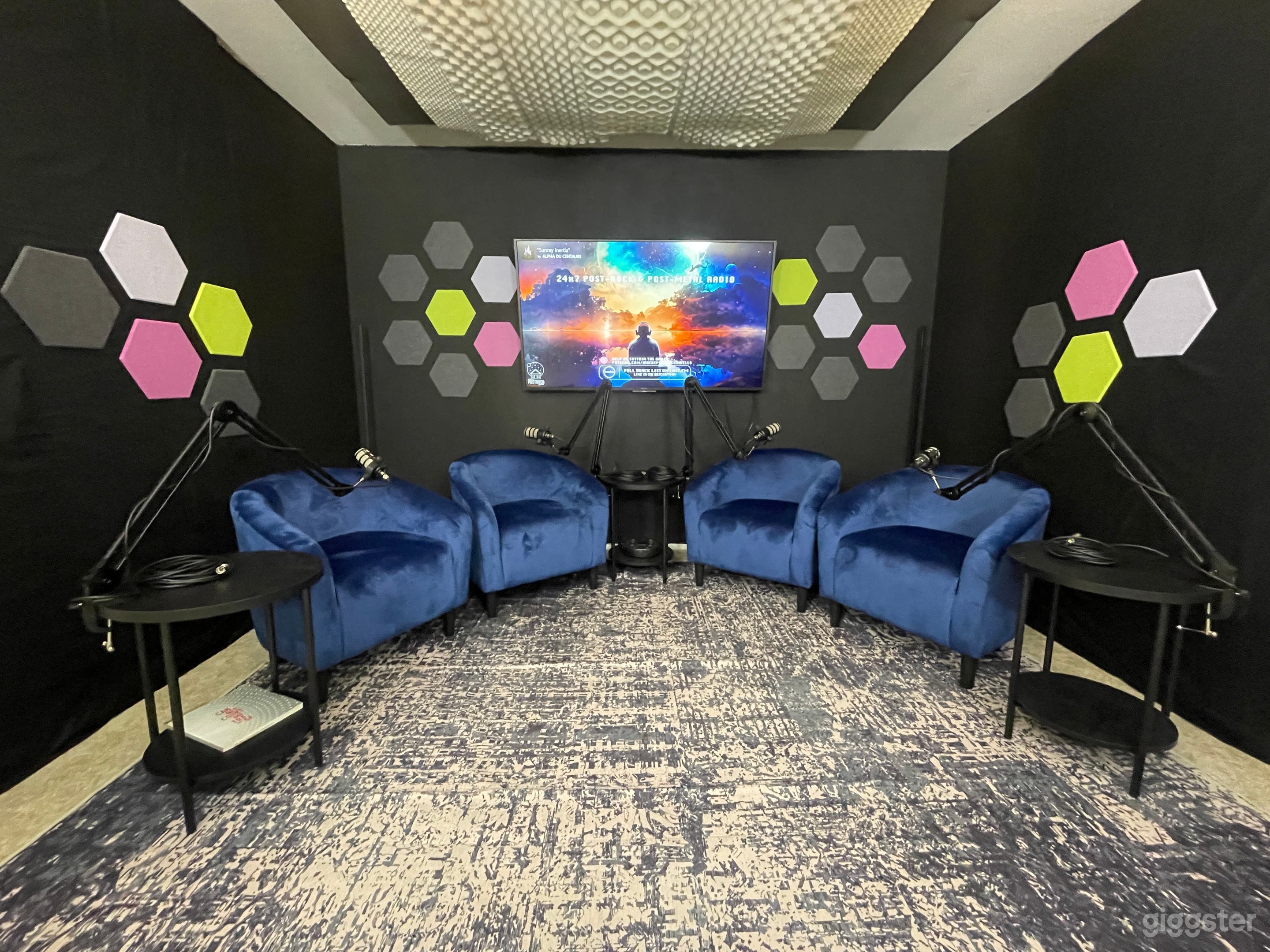 Full Studio from your audience's point of view. Complete with a large 4K television to showcase your brand, comfy sofa chairs, jet black walls, and soundproofing for crystal clear audio capture.