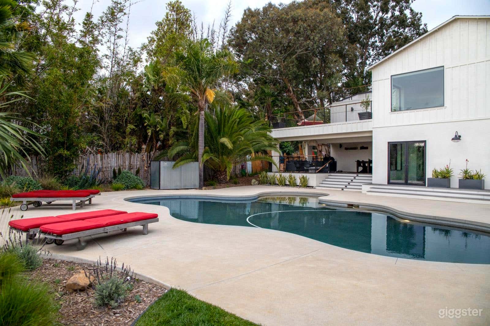 Expansive Farmhouse-Style Backyard with Pool Photo 2