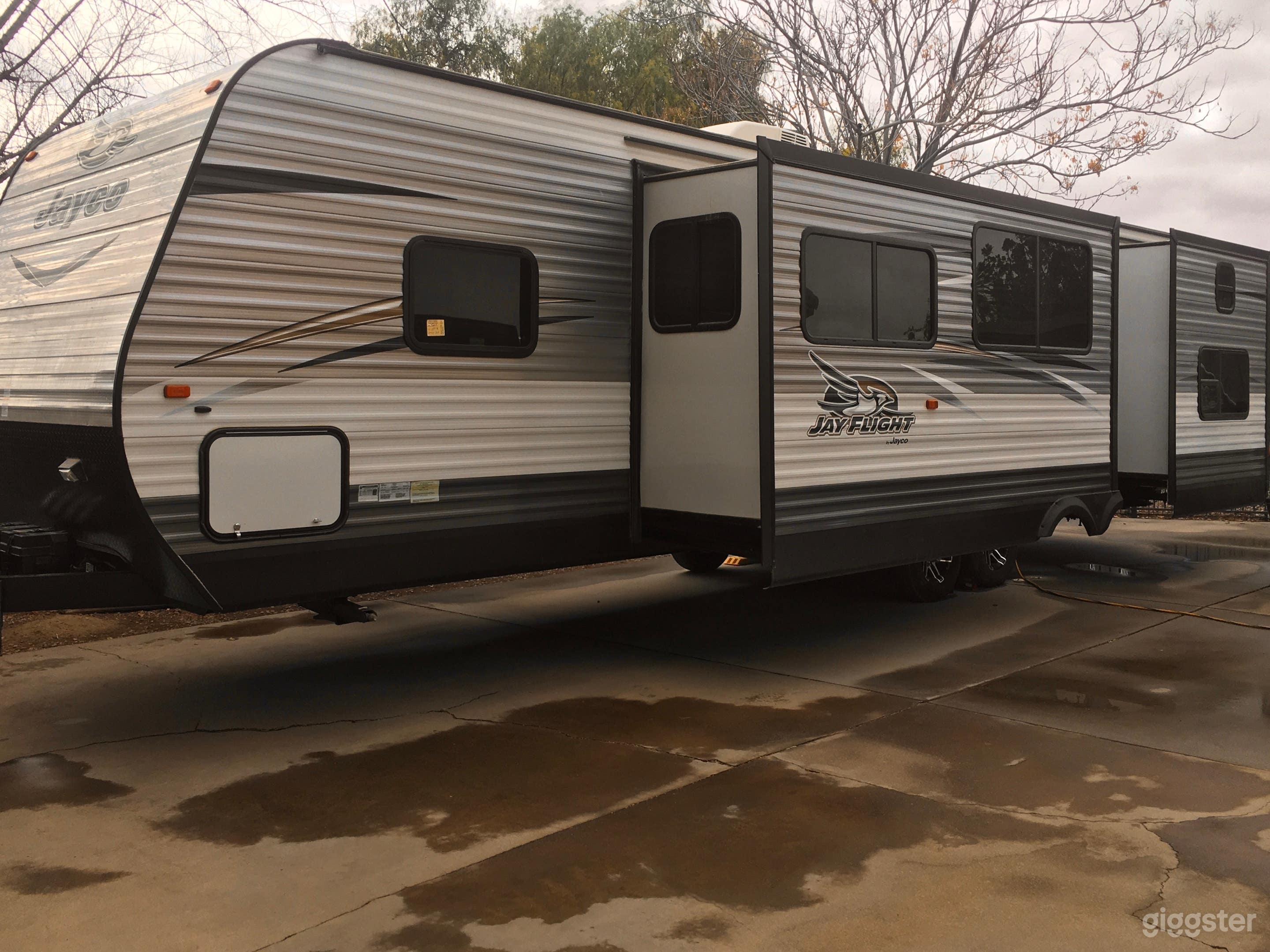 Trailer sleeps 10.  Has master bedroom, separate bedroom with bunks and a daybed, full kitchen, bathroom, etc.  (in case you want to stay here while filming for an extra fee).