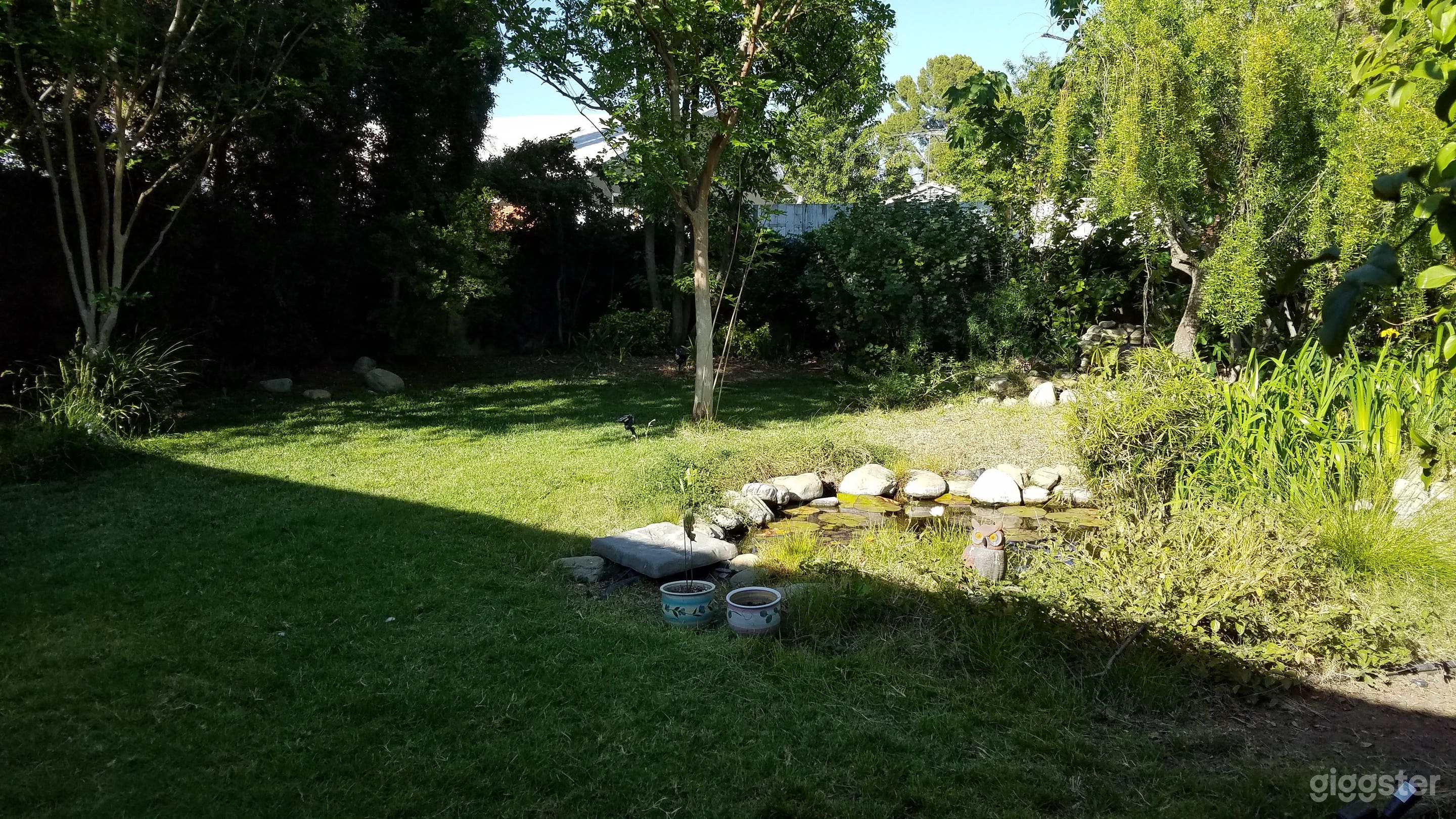 Large, quiet backyard with 11' koi pond.  Generous grassy area.