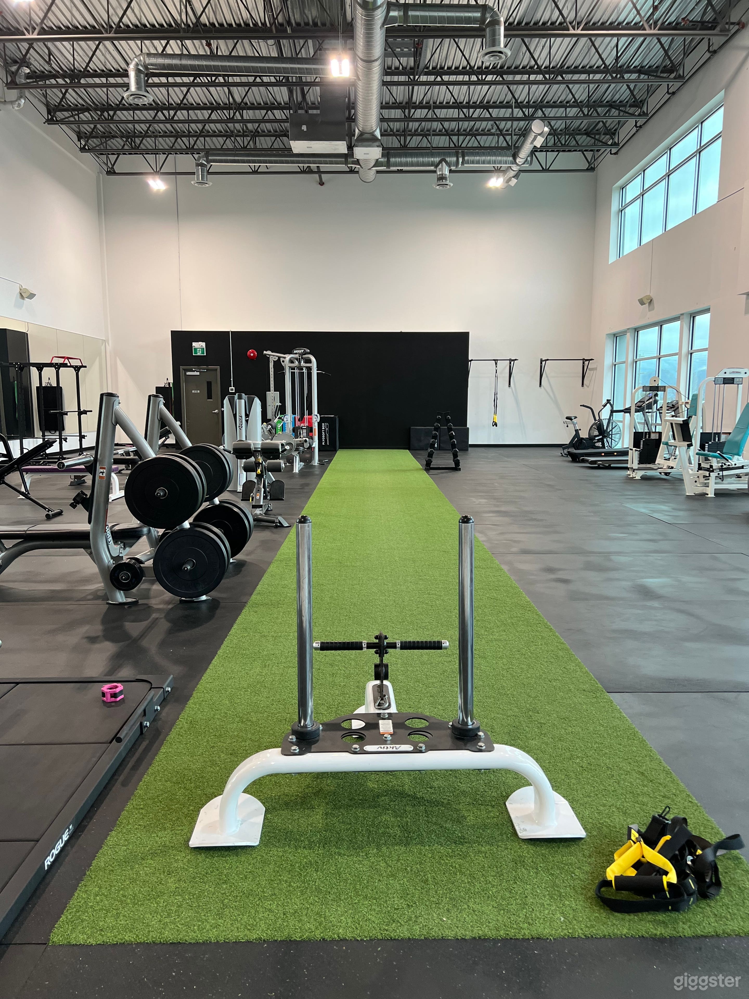 A Large Naturally Lit Industrial Style Gym Photo 1