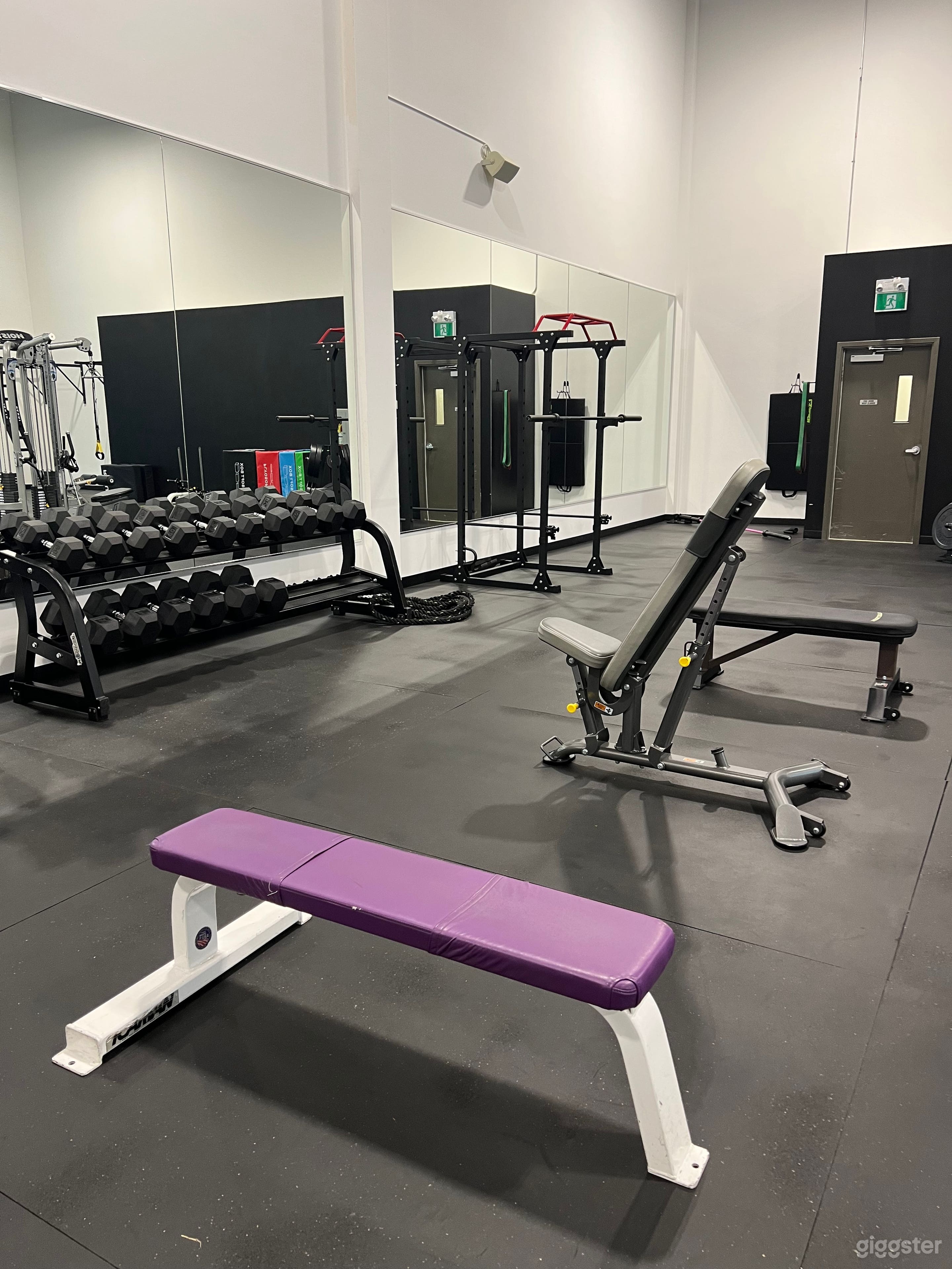 A Large Naturally Lit Industrial Style Gym Photo 2