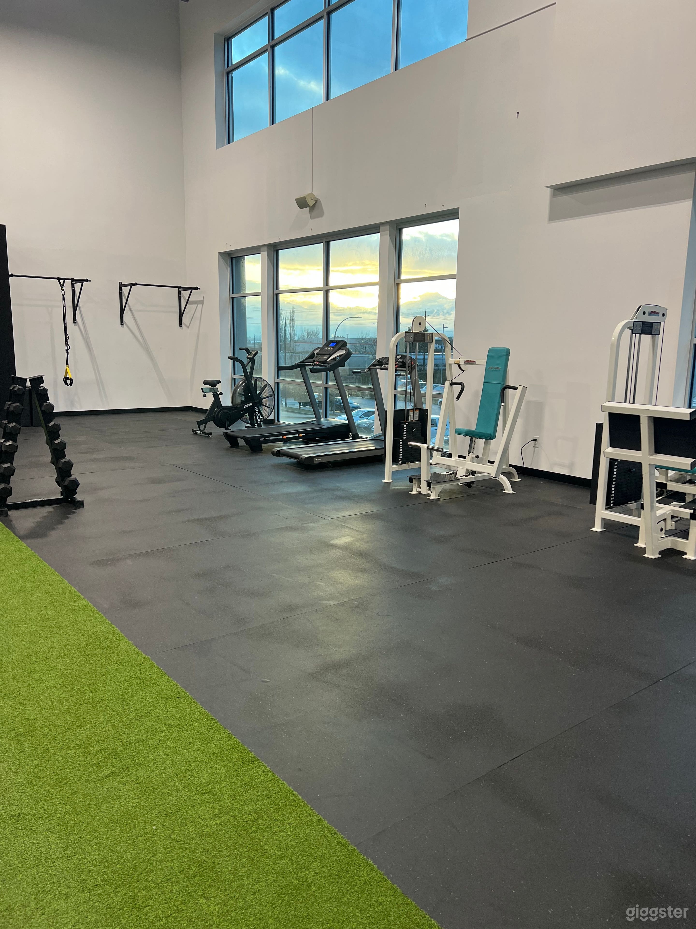 A Large Naturally Lit Industrial Style Gym Photo 4