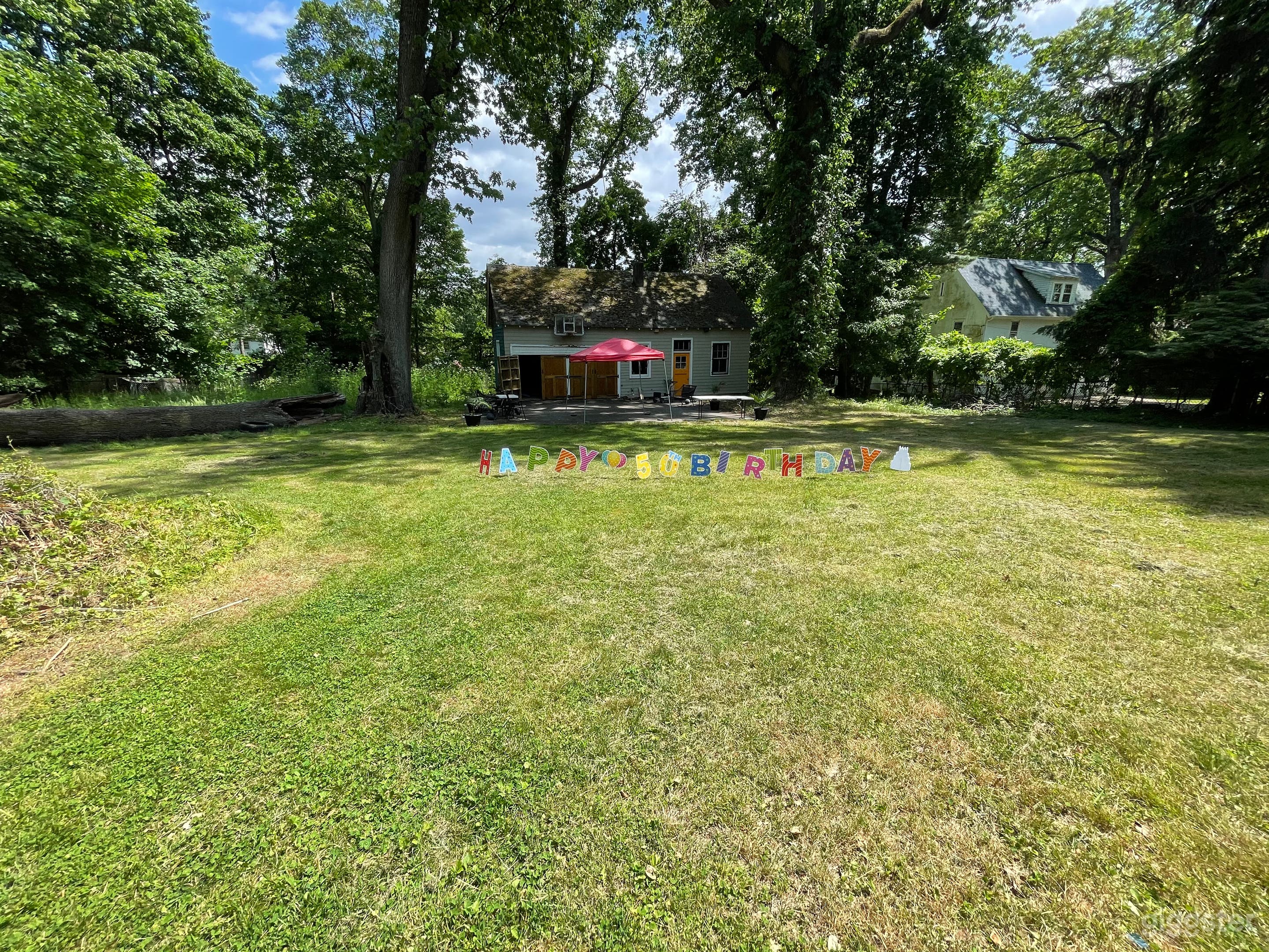 Large backyard with view of the carriage house