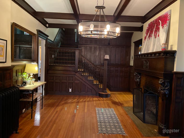  Foyer with large fireplace,  stairway and access to enter four rooms. 