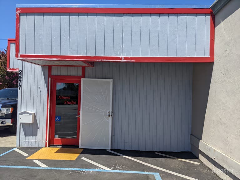  CLEAN AND WELL LIT FITNESS STUDIO WITH EQUIPMENT  