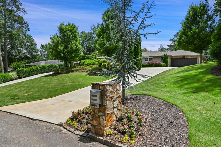  The was taken from the street looking up the sweeping front lawn complete with a circular driveway with ample parking.   