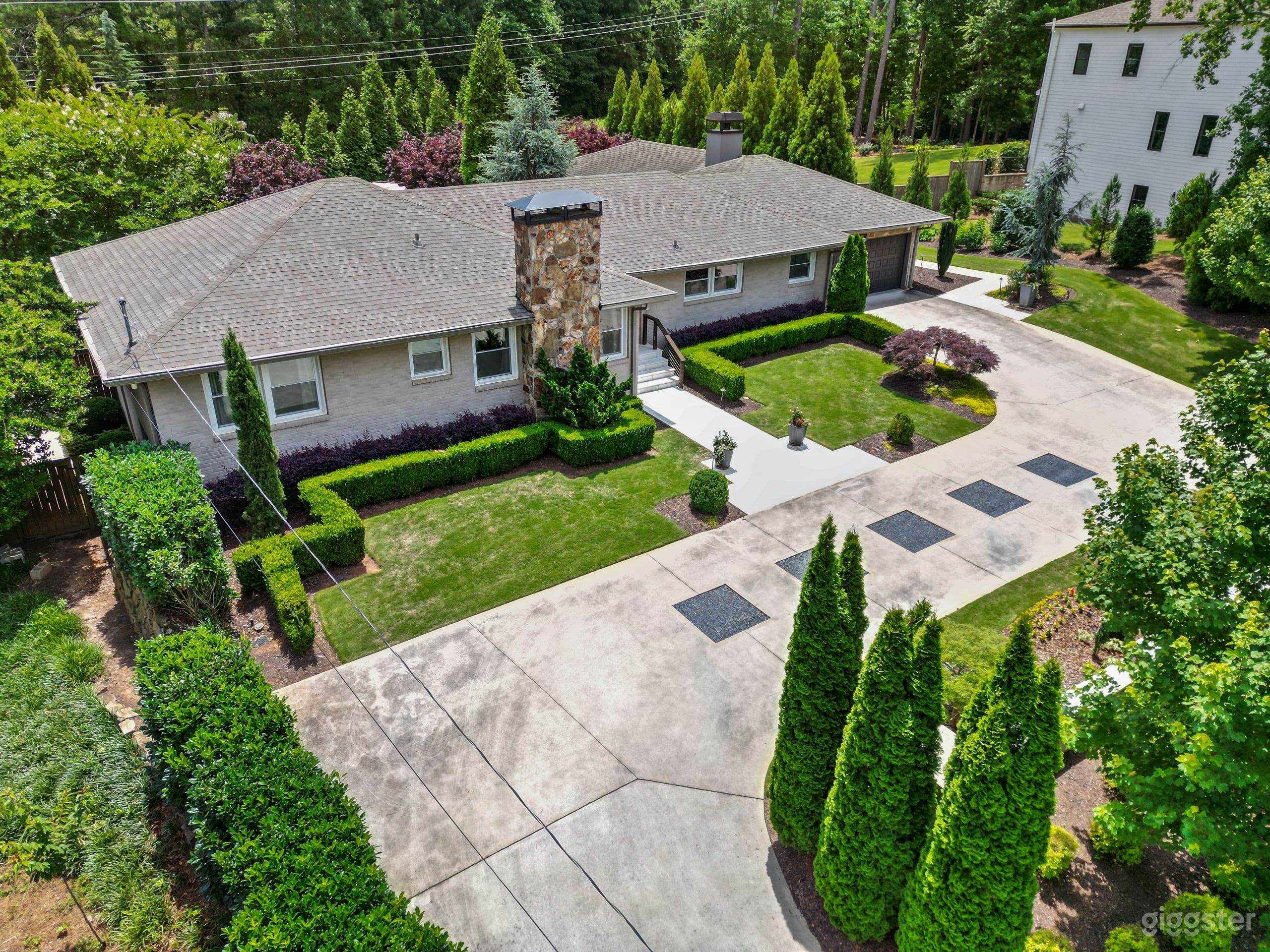 Drone photo looking toward the right side of the front yard that lies behind the wall.  