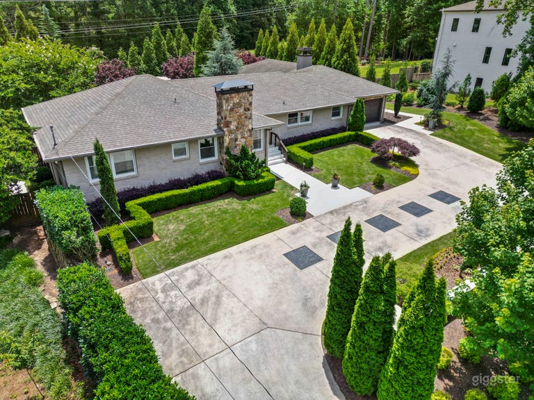  Drone photo looking toward the right side of the front yard that lies behind the wall.   