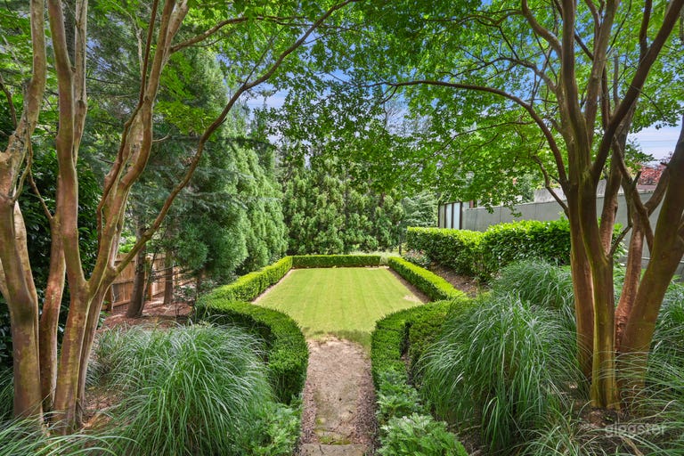  This is a completely separate garden the sits to the left of the pool in a separate outdoor room. 