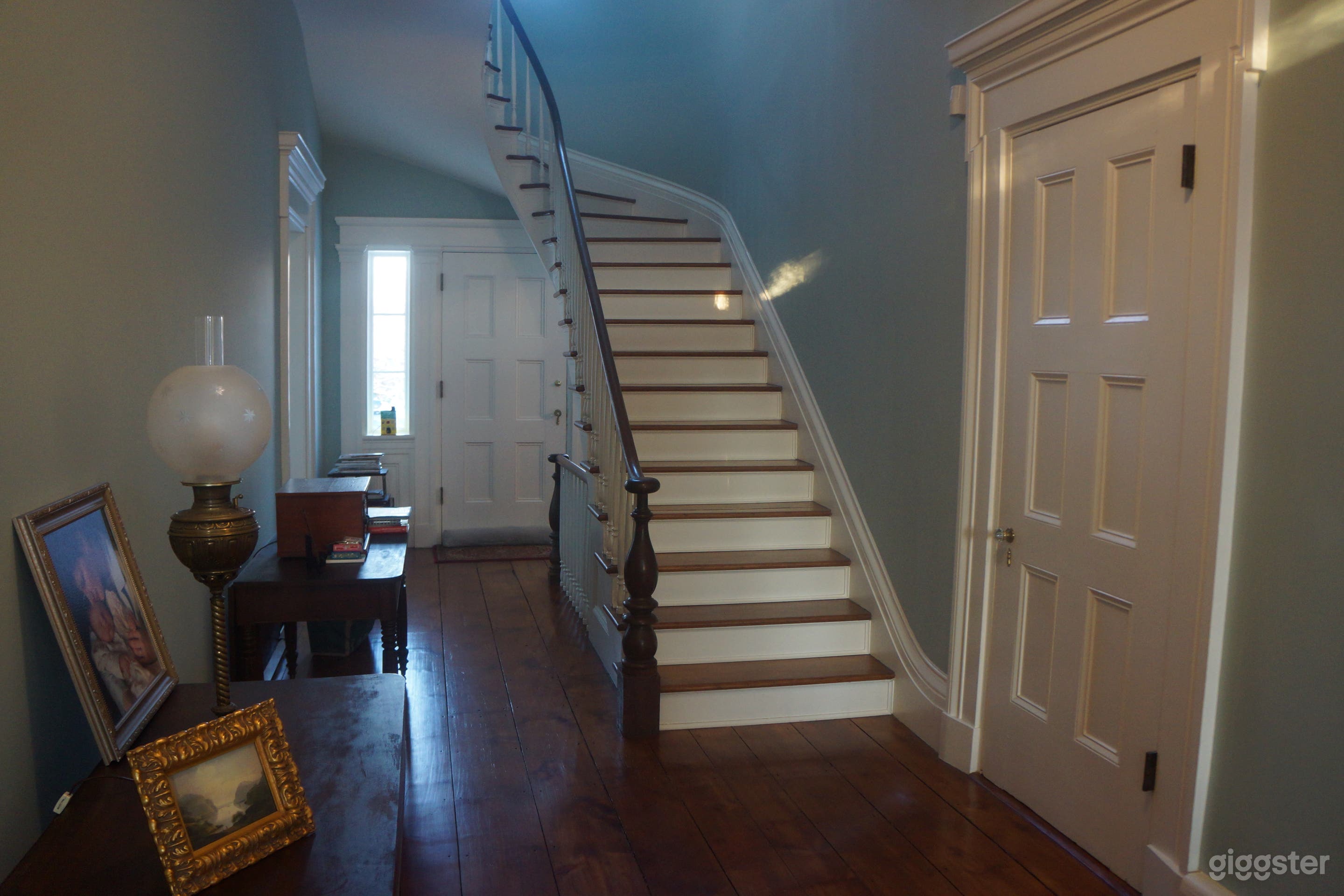 Front Hall is exceptionally wide.  Door to the right of the stairs is a "secret staircase" for the "help."