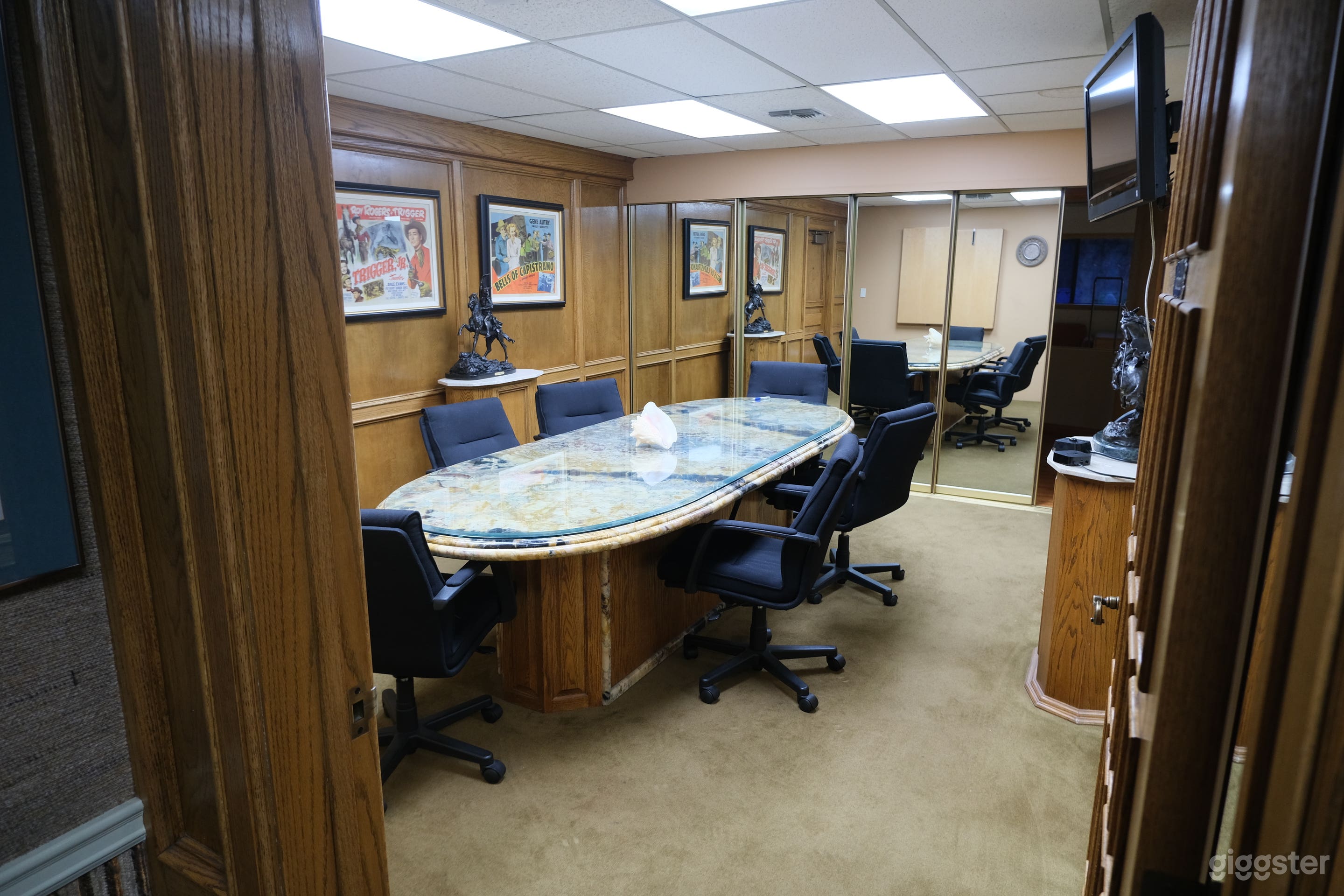 Conference room with sliding Mirrors / Hidden Kitchen
