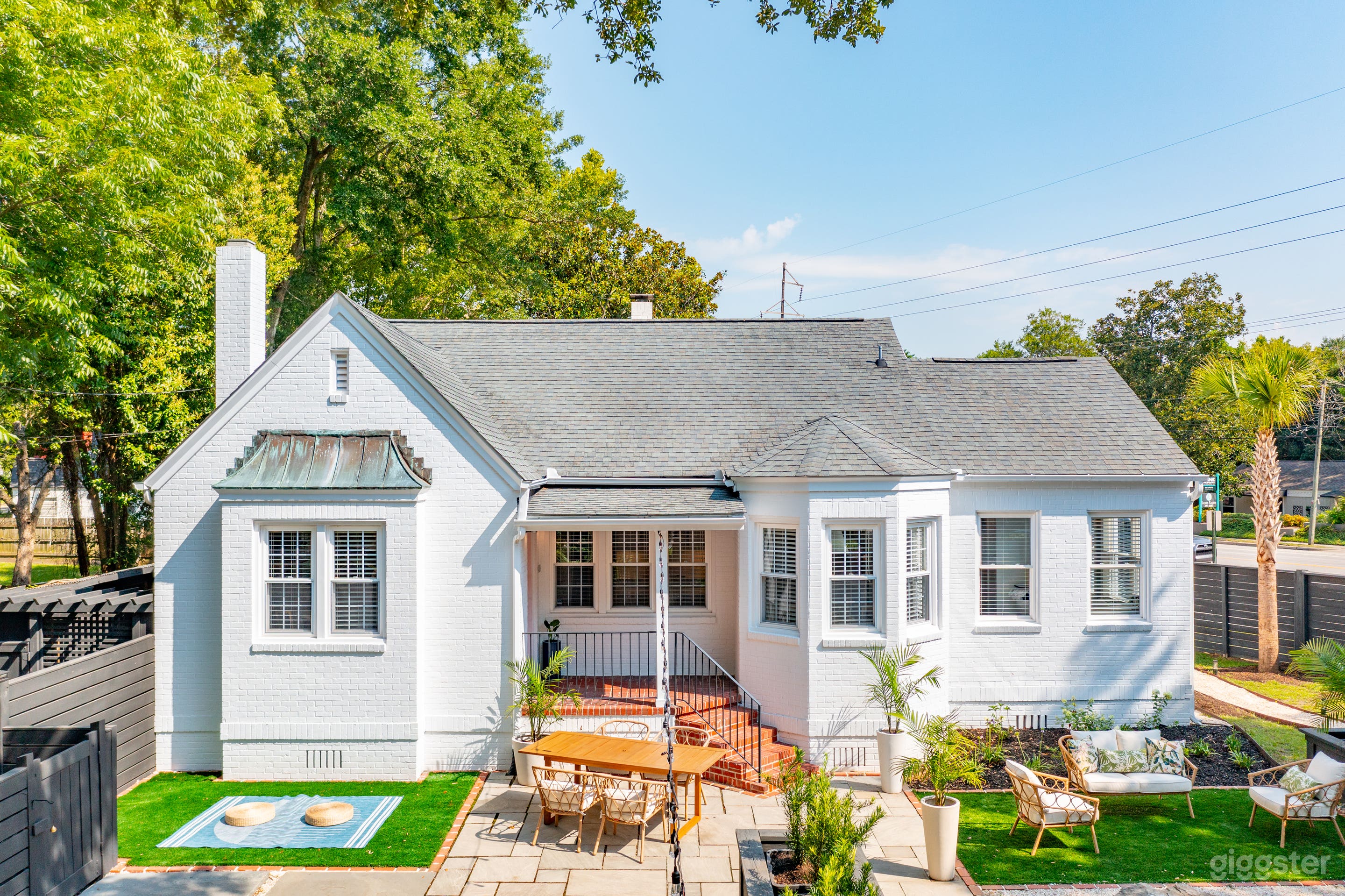 The Southern Zen™ front exterior with blue stone patio and artificial turf for entertaining.