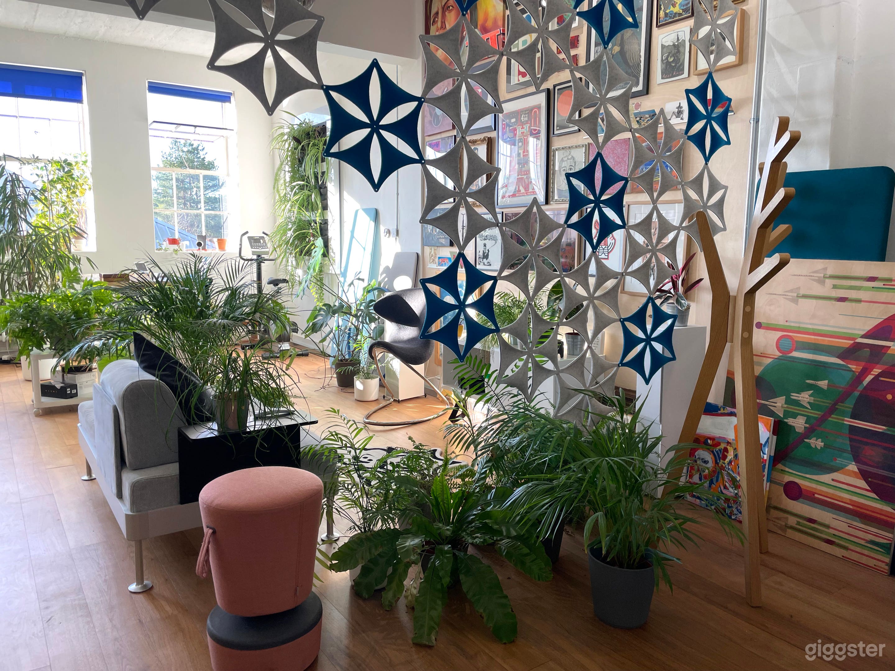 A calm, contemporary office space, designed using biophilic interior design principles - daylight, plants, art, acoustics, colours and natural materials.