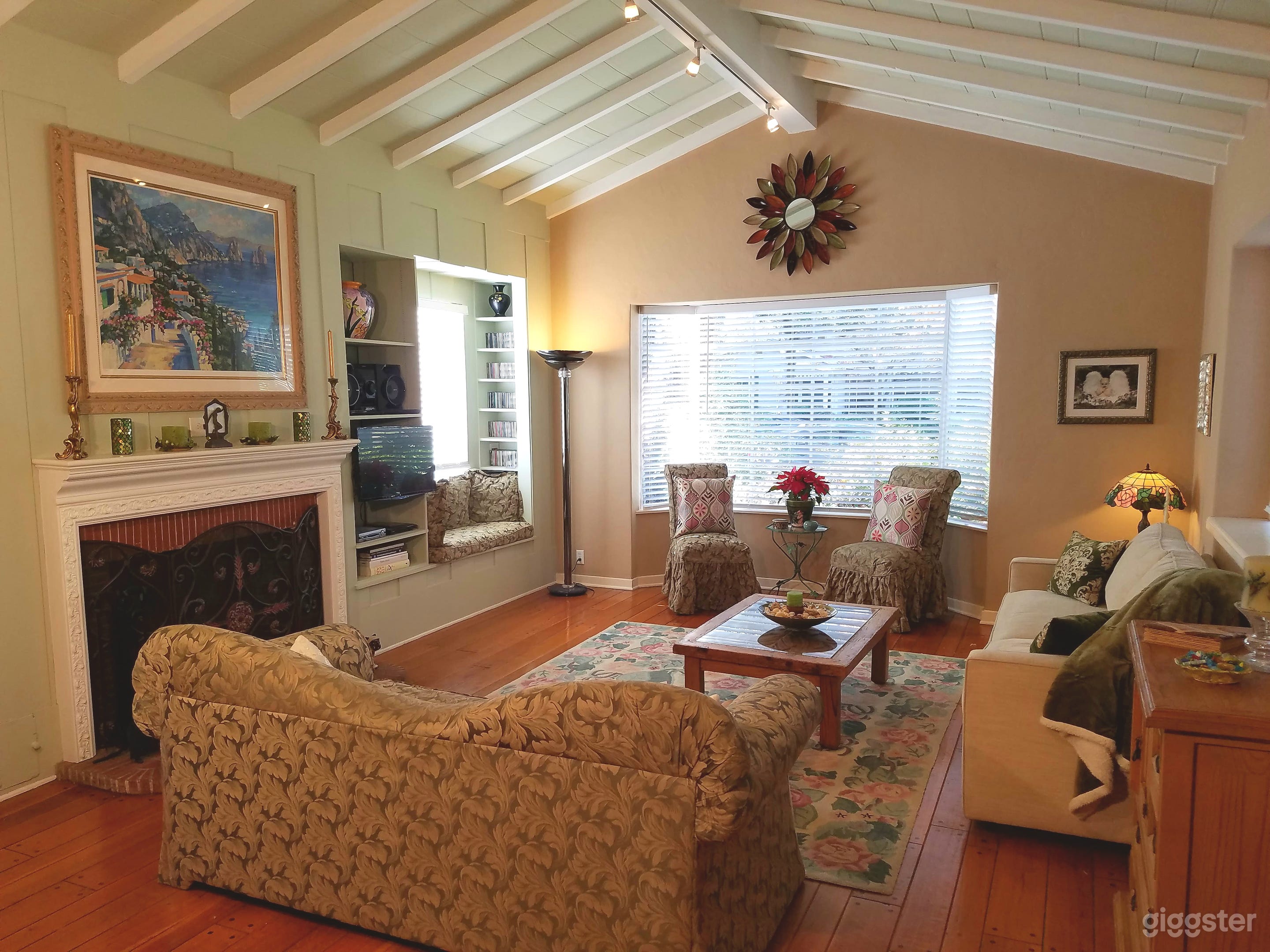 The living room is spacious with vaulted ceilings.