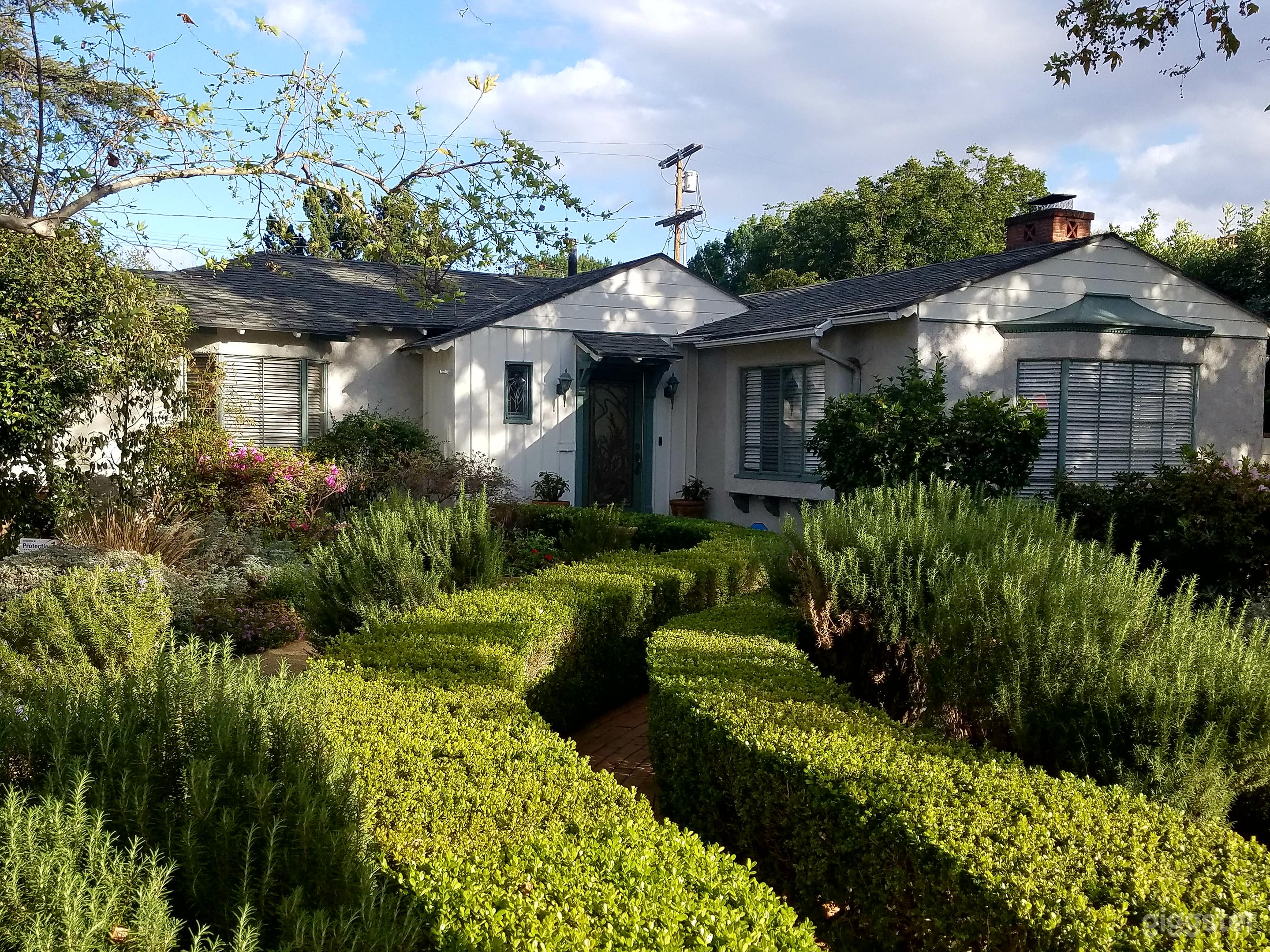 This historic Ranch House was built in 1936 and still maintains Vintage charm inside and out!  There are no Palm tress on the Property, so It could work for any part of the country!