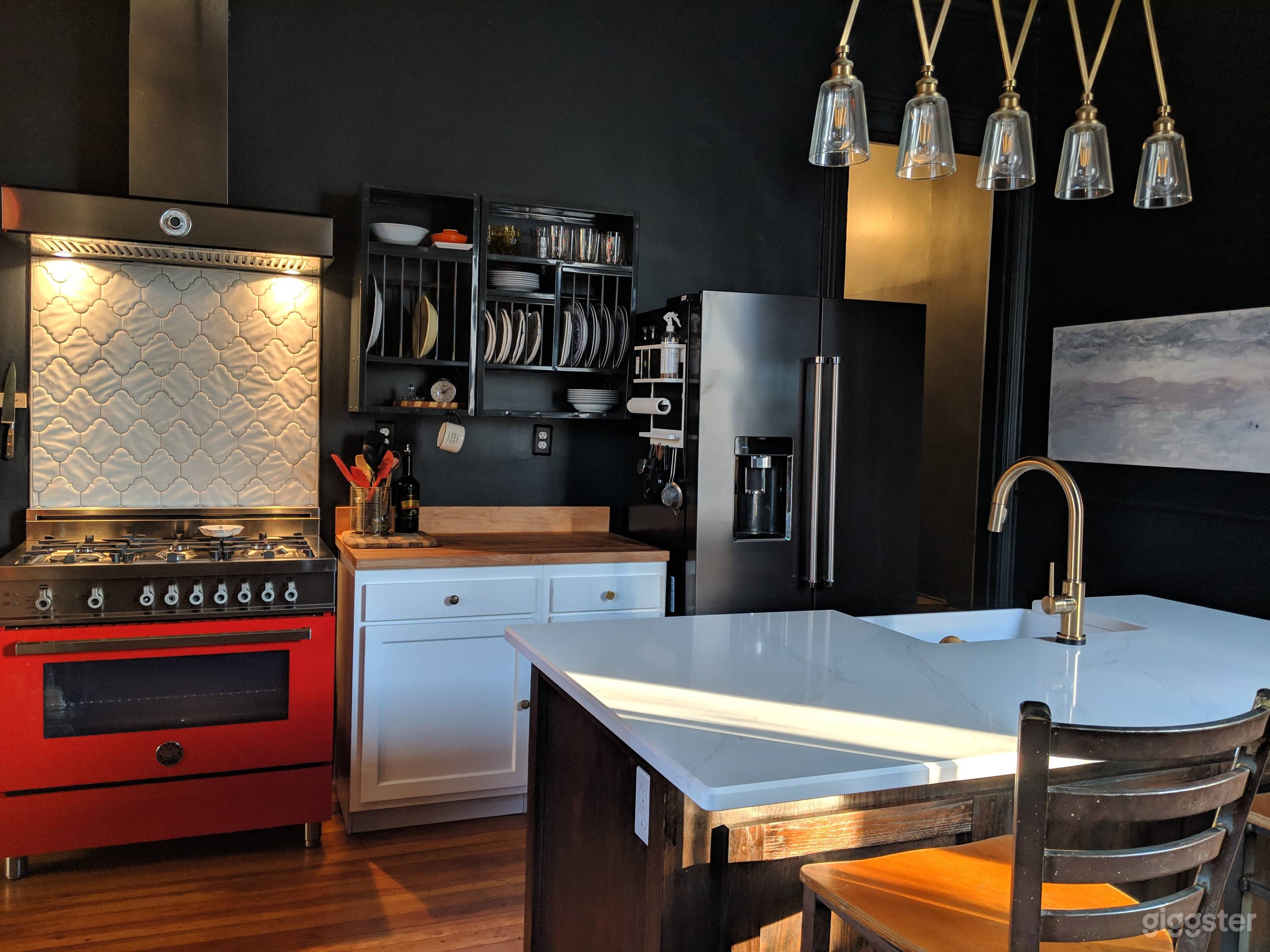 The kitchen stars a Ferrari red 6 burner Bertazzoni range
