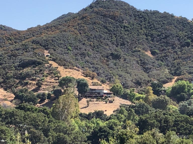  Aerial view of property with a 2500 square foot main house, listed for rent seperately.  