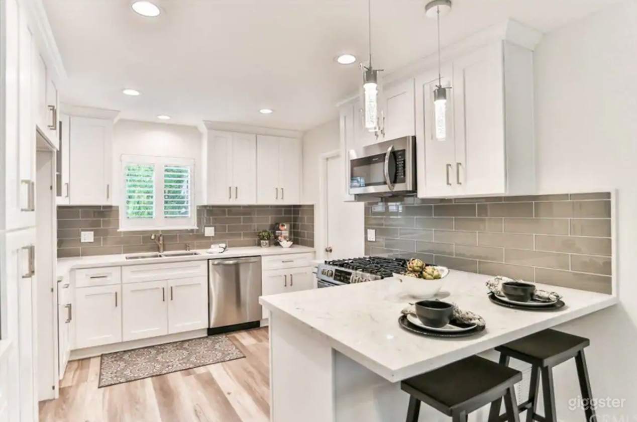Modern, white kitchen.