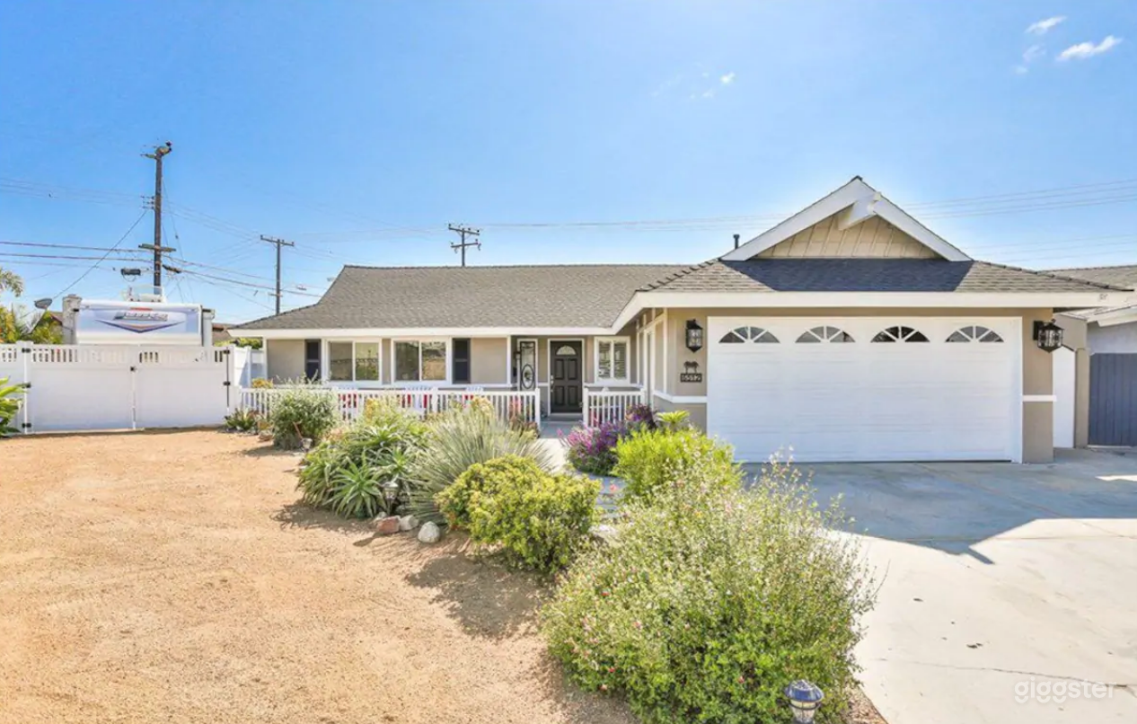 Dirt driveway leading to a side yard.