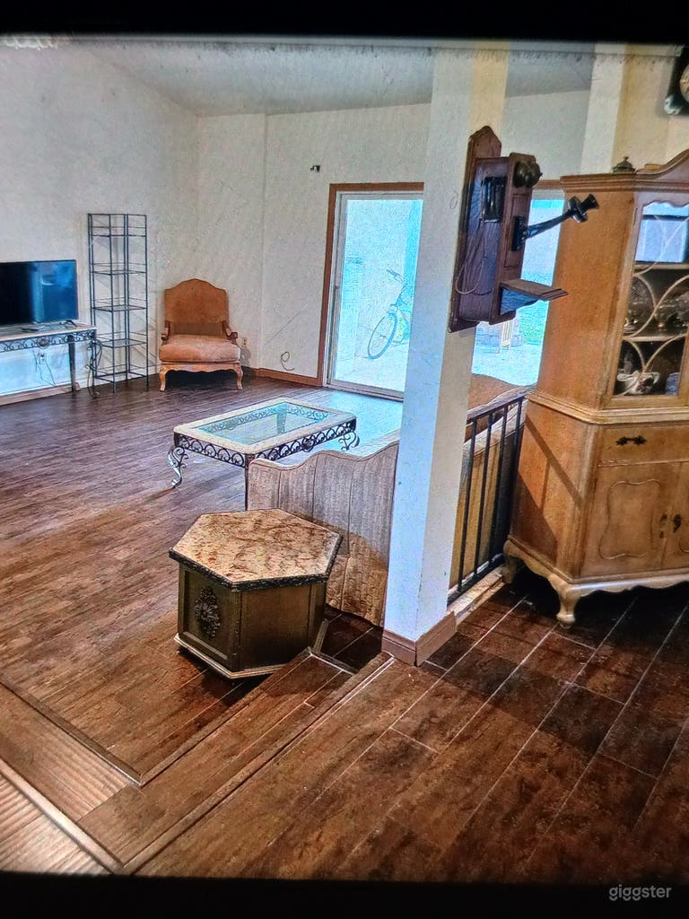  Open floor plan. Sunkin living room with vaulted ceilings with thick dark wood beams. Sliding glass doors leading to covered patio and hot tub and back yard. 