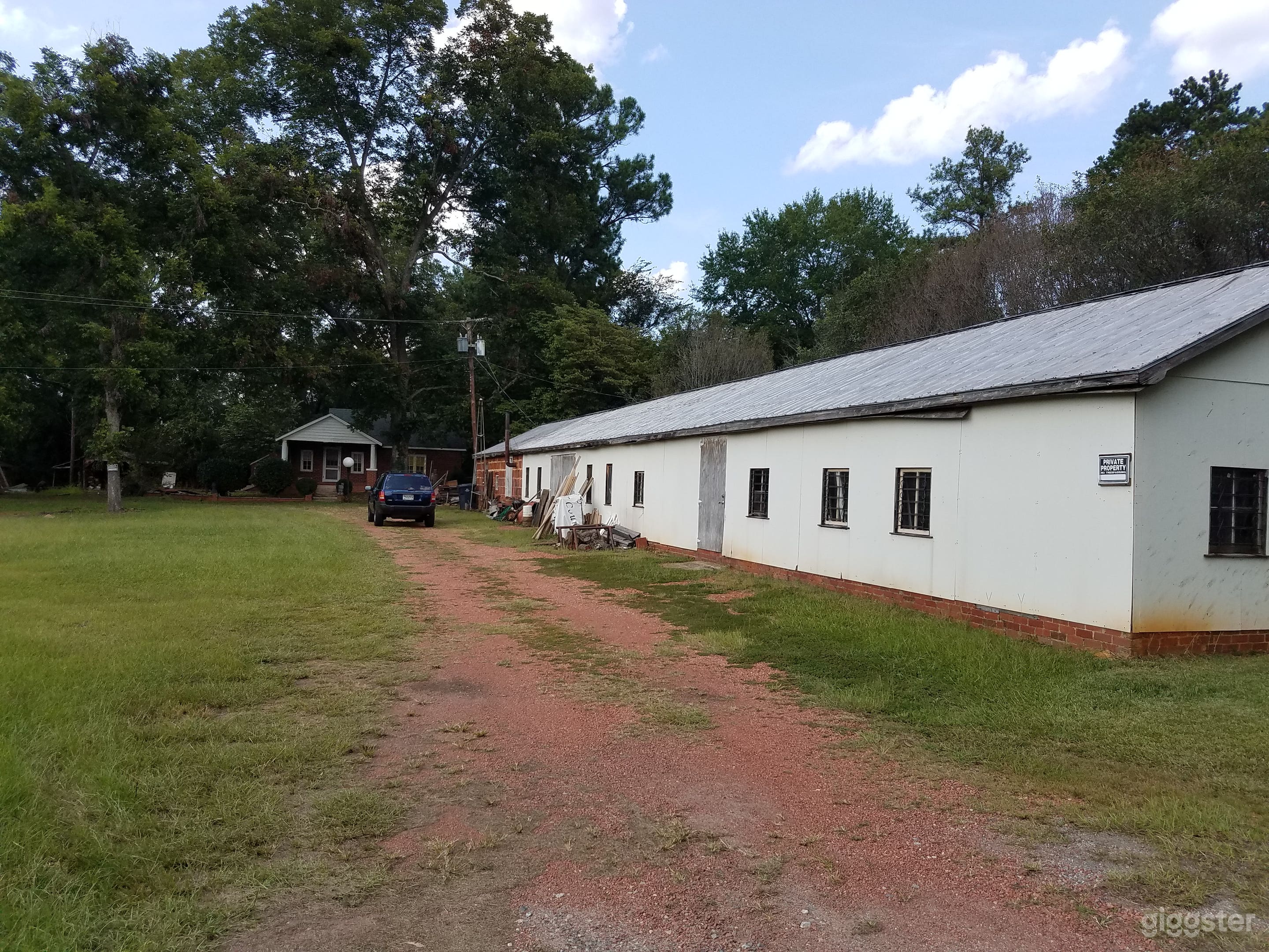 Road view length of warehouse.  It has 3 entrances.