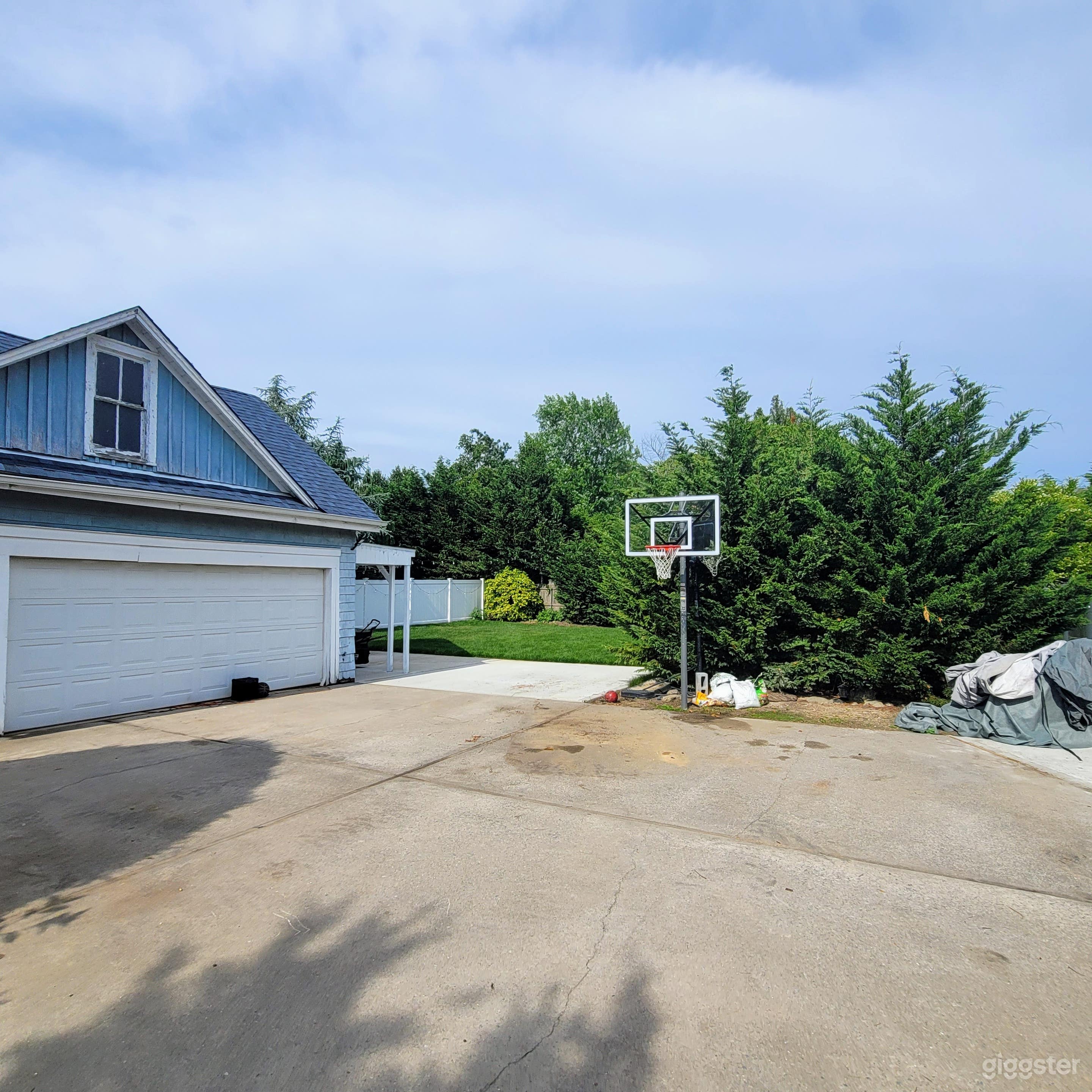 3 car garage and basketball court. (Just before the 2nd backyard area. 