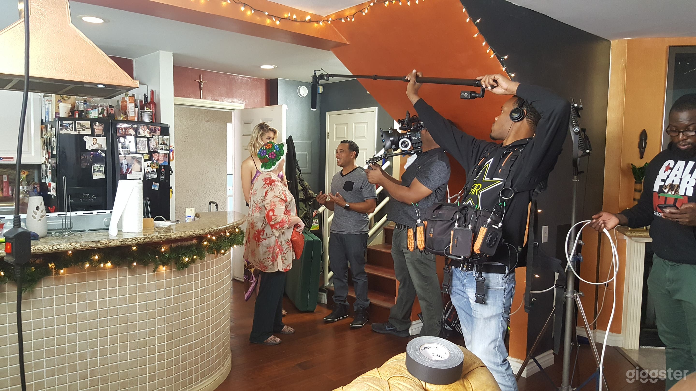 View from living room of the kitchen, stairs landing and front door. 