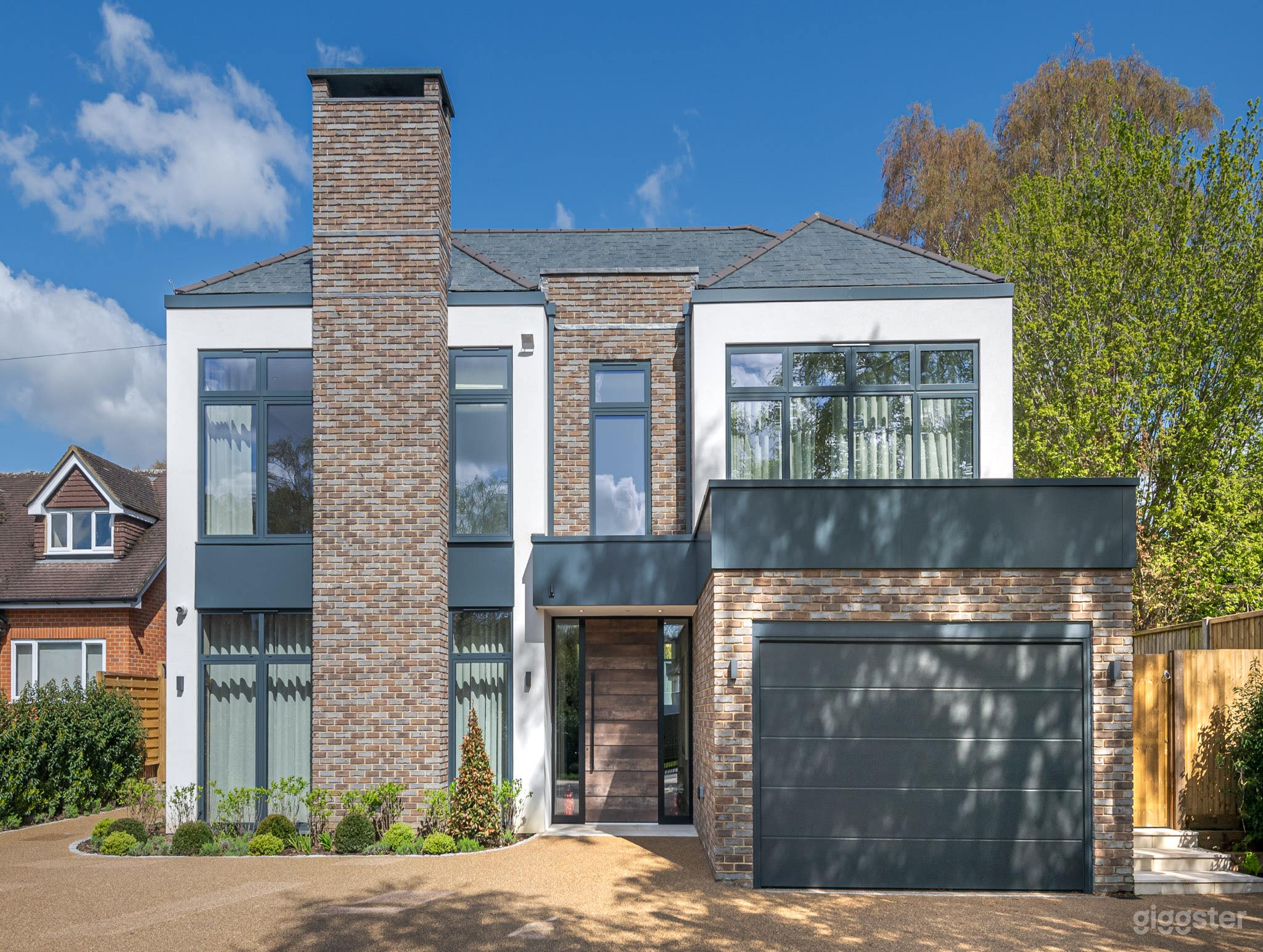 Architecturally-Designed Home With Pool and Garden Photo 3