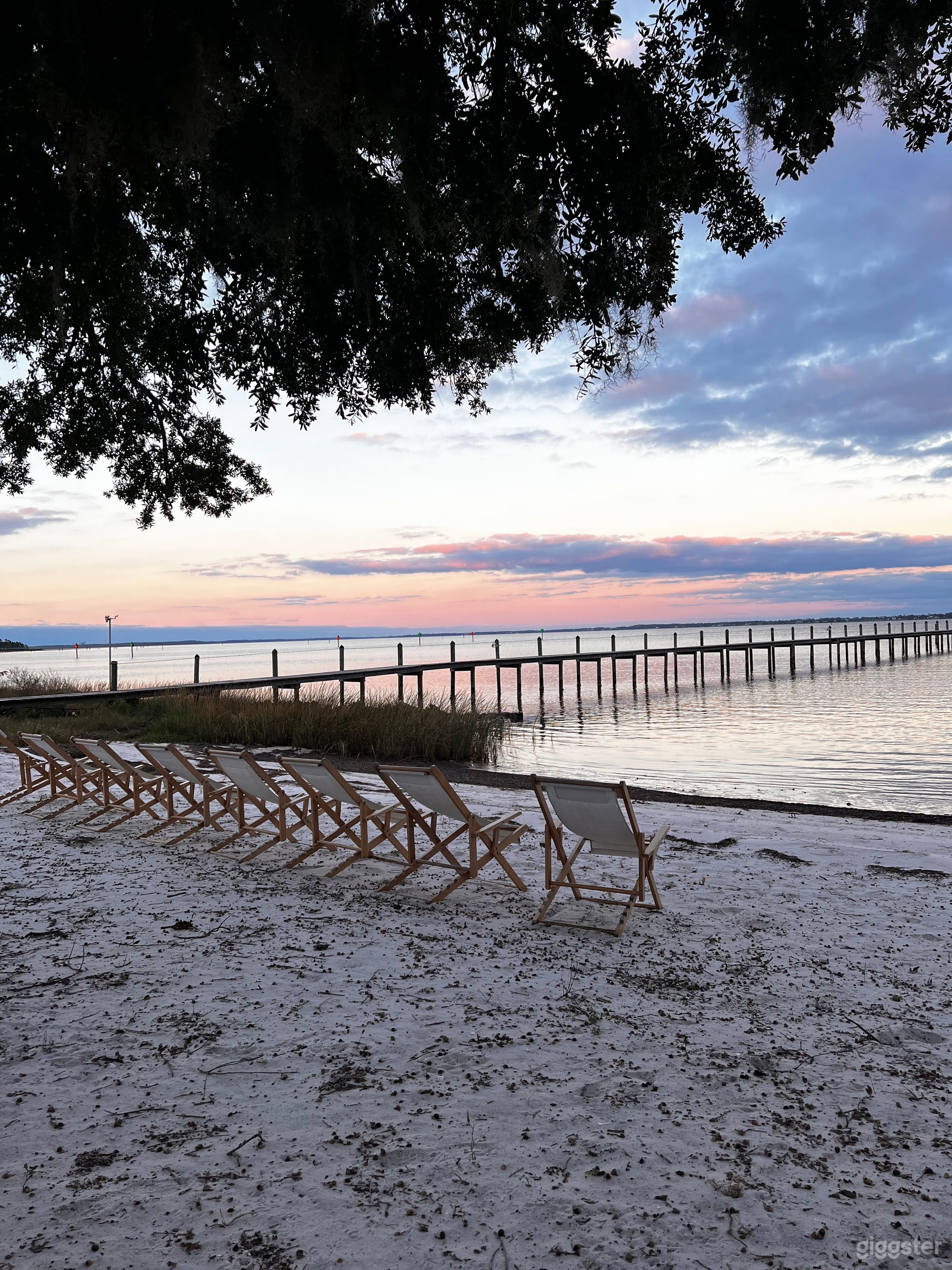 Private white sand beach with seating 
