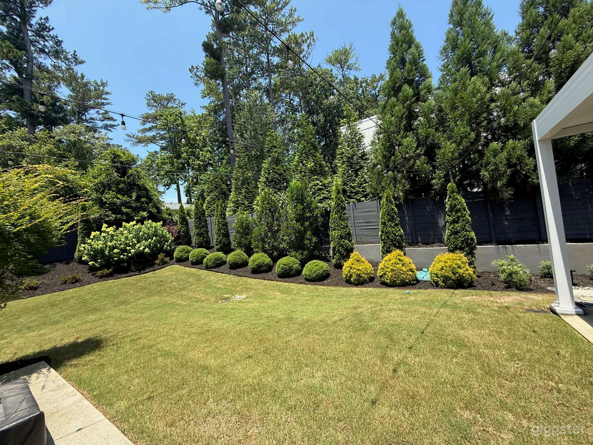 Modern Backyard with Outdoor Movie Setup Photo 2